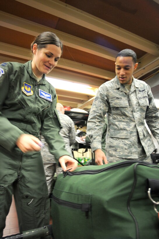 Capt. Jennifer Lewis (left) and Senior Airman Benjamin Pace of the 86th Aeromedical Evacuation Squadron finish packing medical supplies at Ramstein Air Base, Germany, on Oct. 28, 2011, before loading on to an aircraft prior to an air evacuation mission to evacuate 26 injured freedom fighters from Tripoli, Libya. Two aircraft transported 26 seriously wounded fighters to Spaulding Rehabilitation Hospital in Boston, Mass. An additional five critical cases will be transferred to Germany for immediate care. All patients were injured as a result of recent fighting and suffer from conditions that cannot currently be treated in Libya. (U.S. Army Photo/Pvt. Richard Bartell)