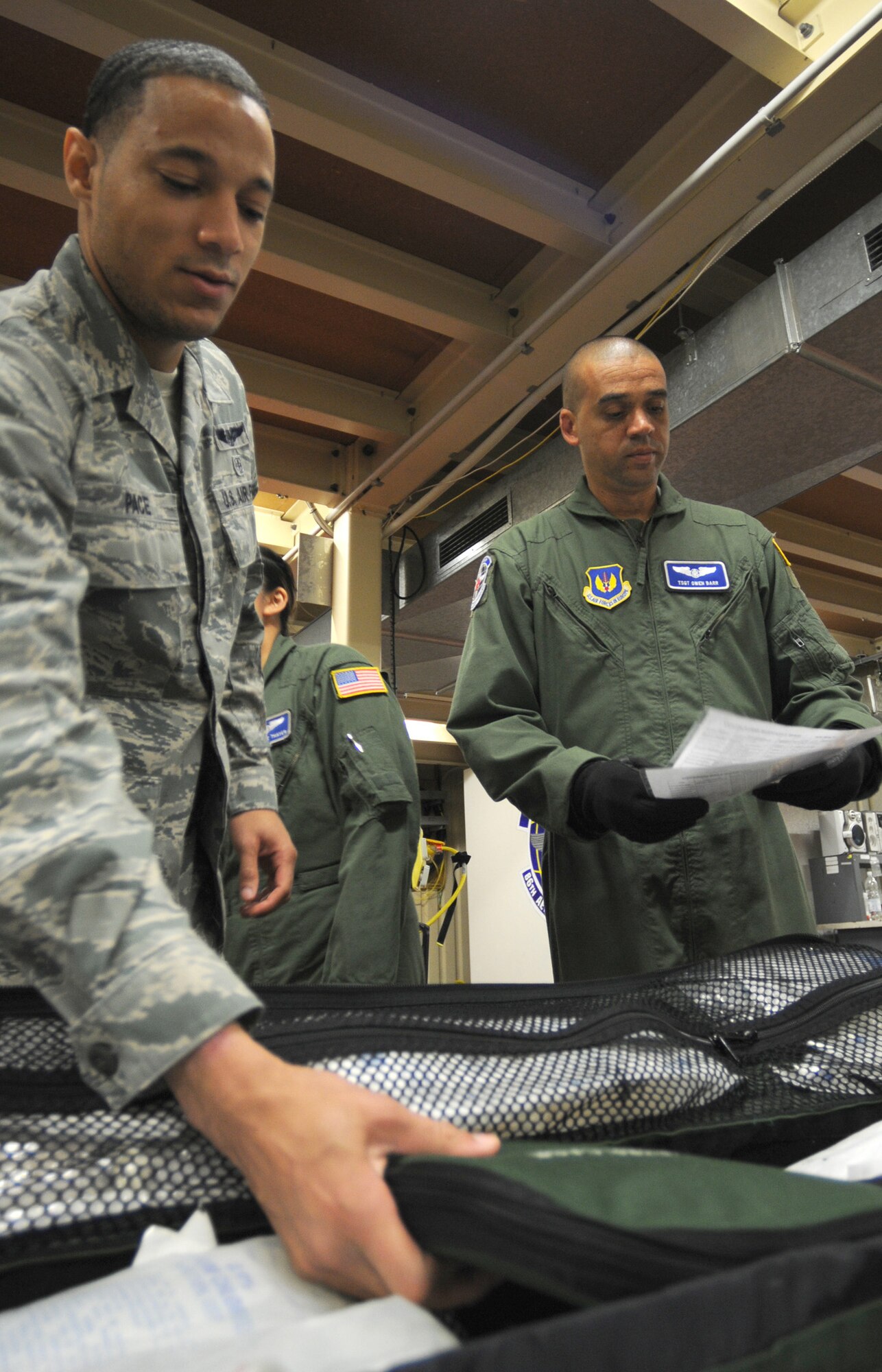 Senior Airman Benjamin Pace (left) and Tech. Sgt. Shawn Clark of the 86th Aeromedical Evacuation Squadron pack medical supplies at Ramstein Air Base, Germany, on Oct. 28, 2011, prior to an air evacuation mission to evacuate 26 injured freedom fighters from Tripoli, Libya. Two aircraft transported 26 seriously wounded fighters to Spaulding Rehabilitation Hospital in Boston, Mass. An additional five critical cases will be transferred to Germany for immediate care. All patients were injured as a result of recent fighting and suffer from conditions that cannot currently be treated in Libya. (U.S. Army Photo/Pvt. Richard Bartell)