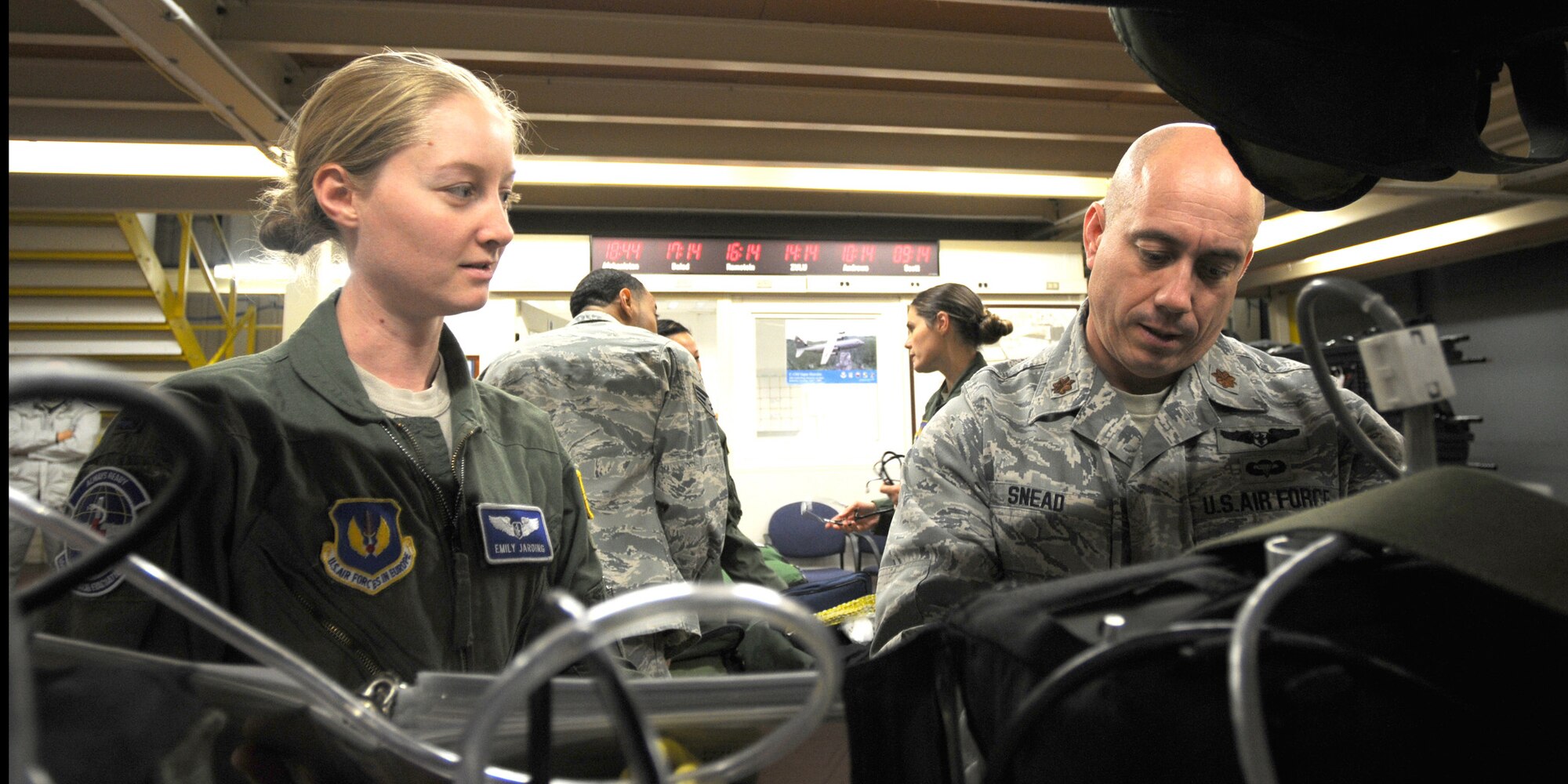 Capt. Emily Jarding (left) and Maj. Pablo Snead of the 86th Aeromedical Evacuation Squadron secure heart defibulator at Ramstein Air Base, Germany, on Oct. 28, 2011, prior to a humanitarian assistance mission evacuating 26 injured freedom fighters from Tripoli, Libya. Two aircraft transported 26 seriously wounded fighters to Spaulding Rehabilitation Hospital in Boston, Mass. An additional five critical cases were transferred to Germany for immediate care. All patients were injured as a result of recent fighting and suffer from conditions that cannot currently be treated in Libya. (U.S. Army Photo/Pvt. Richard Bartell)