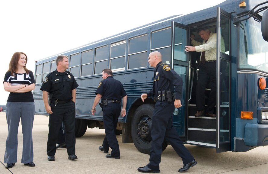 Members of the Bossier Sheriff and Police departments exit a bus near the flight-line on Barksdale Air Force Base, La., Oct. 27. The officers were taking a tour of Barksdale which included a static display of a B-52H Stratofortess and the new 2nd Security Forces Squadron building. (U.S. Air Force photo/Airman 1st Class Benjamin Gonsier)(RELEASED)