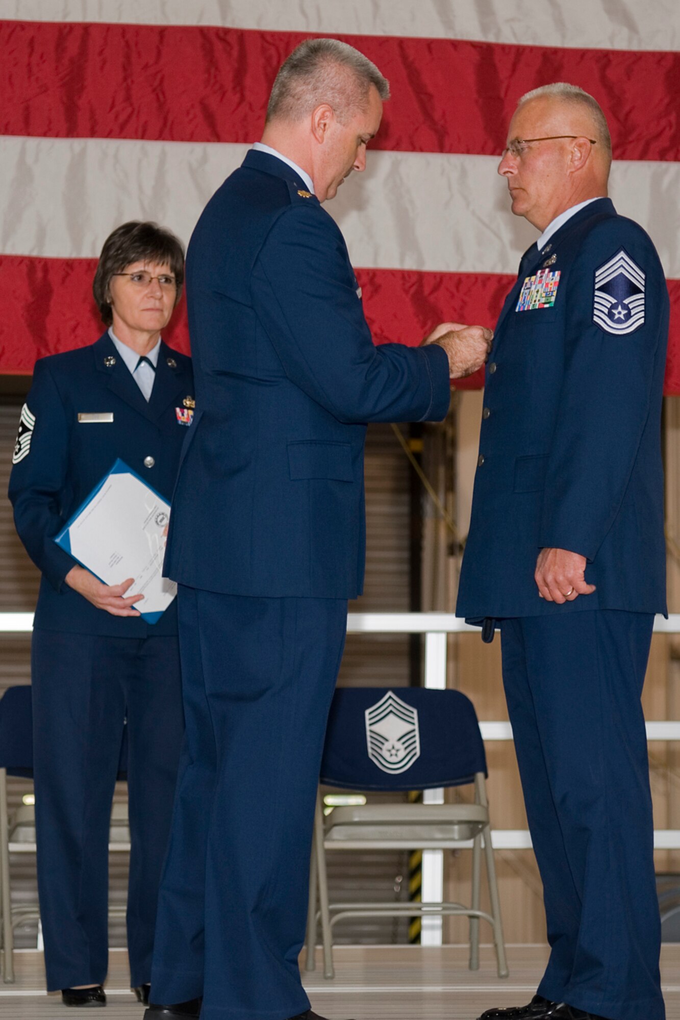 GRISSOM AIR RESERVE BASE, Ind. -- Maj. Timothy Bartlett, 434th Aircraft Maintenance Squadron commander, pins on a Meritorious Service Medal to Chief Master Sgt. Michael Fornal, 434th AMXS superintendant during his retirement ceremony Oct. 15. Fornal retired after serving 34 years in the Air Force. (U.S. Air Force photo/Senior Airman Jami K. Lancette)