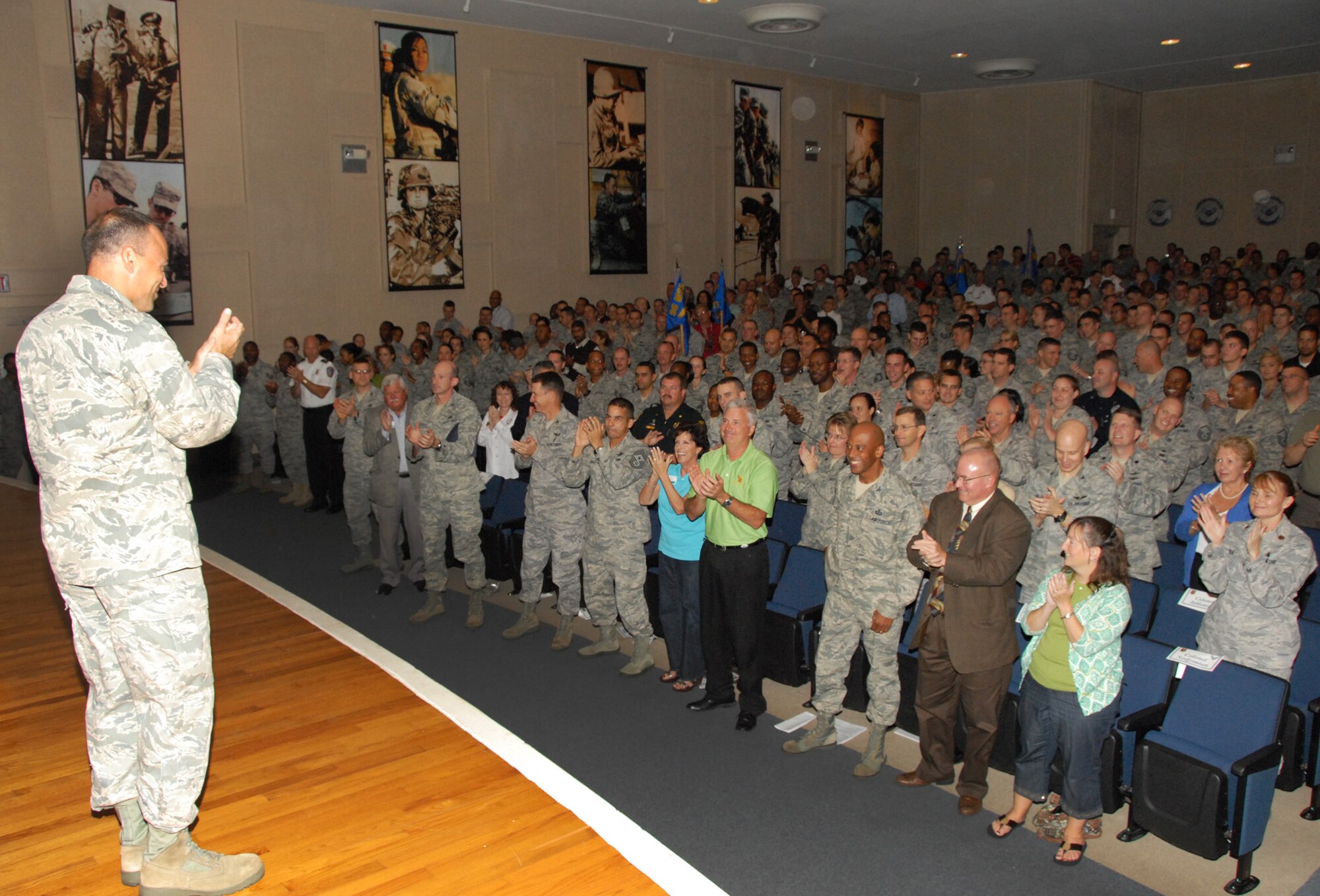 Col. Sal Nodjomian, 96th Air Base Wing commander, applauds his wing after announcing the results of the Operational Readiness Inspection Oct. 28 at Eglin Air Force Base, Fla.  The wing received an overall excellent rating in all four areas of the inspection and more than 200 people were recognized for their efforts.  (U.S. Air Force photo/Kevin Gaddie)