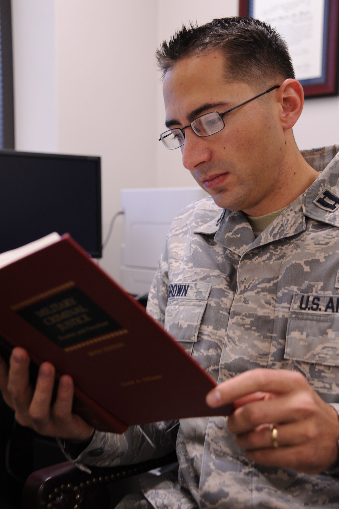 Capt. Elijah Brown, 19th Airlift Wing Air Force Legal Operations Agency area defense counsel, researches a law case for an upcoming court martial Oct. 27, Brown represents individual Airmen in courts-martial, article 15’s and other adverse administrative actions such as letters of counseling and referral enlisted performance reports. (U.S. Air Force Photo by Airman 1st Class Kaylee Clark)