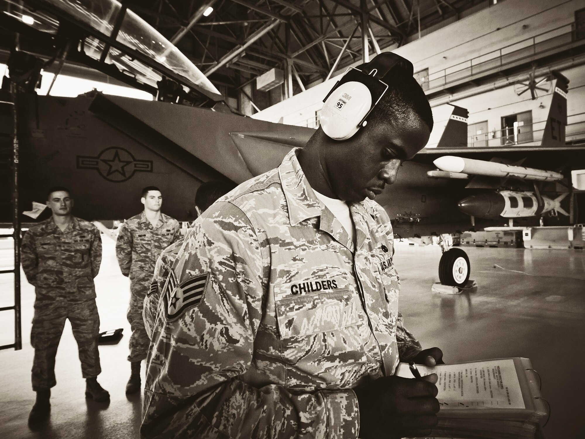 Staff Sgt. Anthony Childers, 46th Aircraft Maintenance Squadron crew leader, completes checks of his F-15 during the 46th Maintenance Group’s third quarter weapons load competition at Eglin Air Force Base, Fla., Oct. 28.  The best of the best from AMU Red and AMU Blue met to load a Joint Direct Attack Munition and an AIM-9 onto an F-15 and F-16 respectively.  AMU Red won with the best time and fewest errors.  (U.S. Air Force photo/Samuel King Jr.)