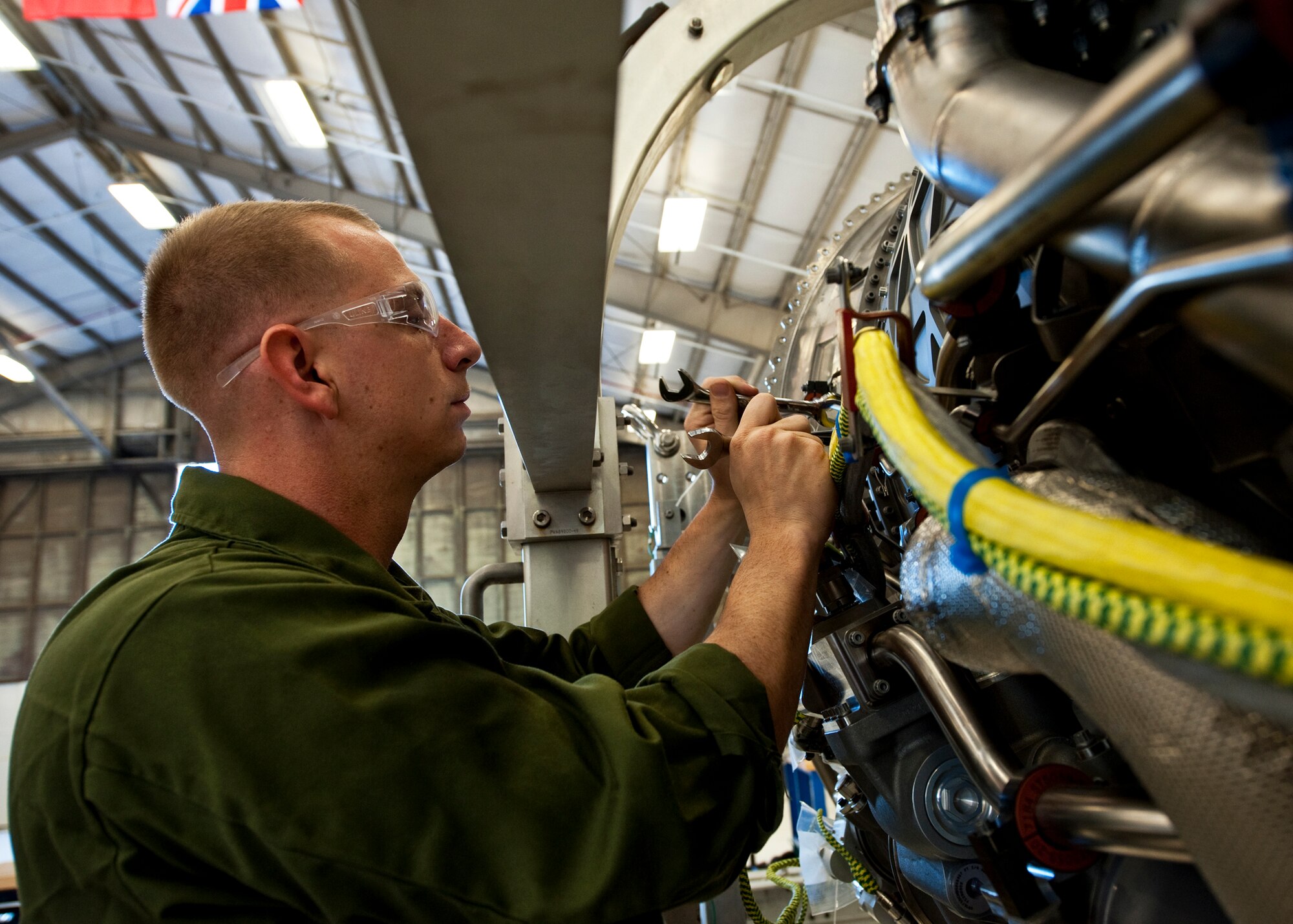 Sgt. Orazio Cara, a Marine Fighter Attack Training Squadron 501 maintainer, makes adjustments to an F-35 Lightning II joint strike fighter engine at Eglin Air Force Base, Fla., Oct. 27.  Airmen, Marines and Sailors are executing step-by-step processes to validate engine maintenance procedures for the F-135 to ensure they are sound before being taught to future F-35 maintainers.  (U.S. Air Force photo/Samuel King Jr.)