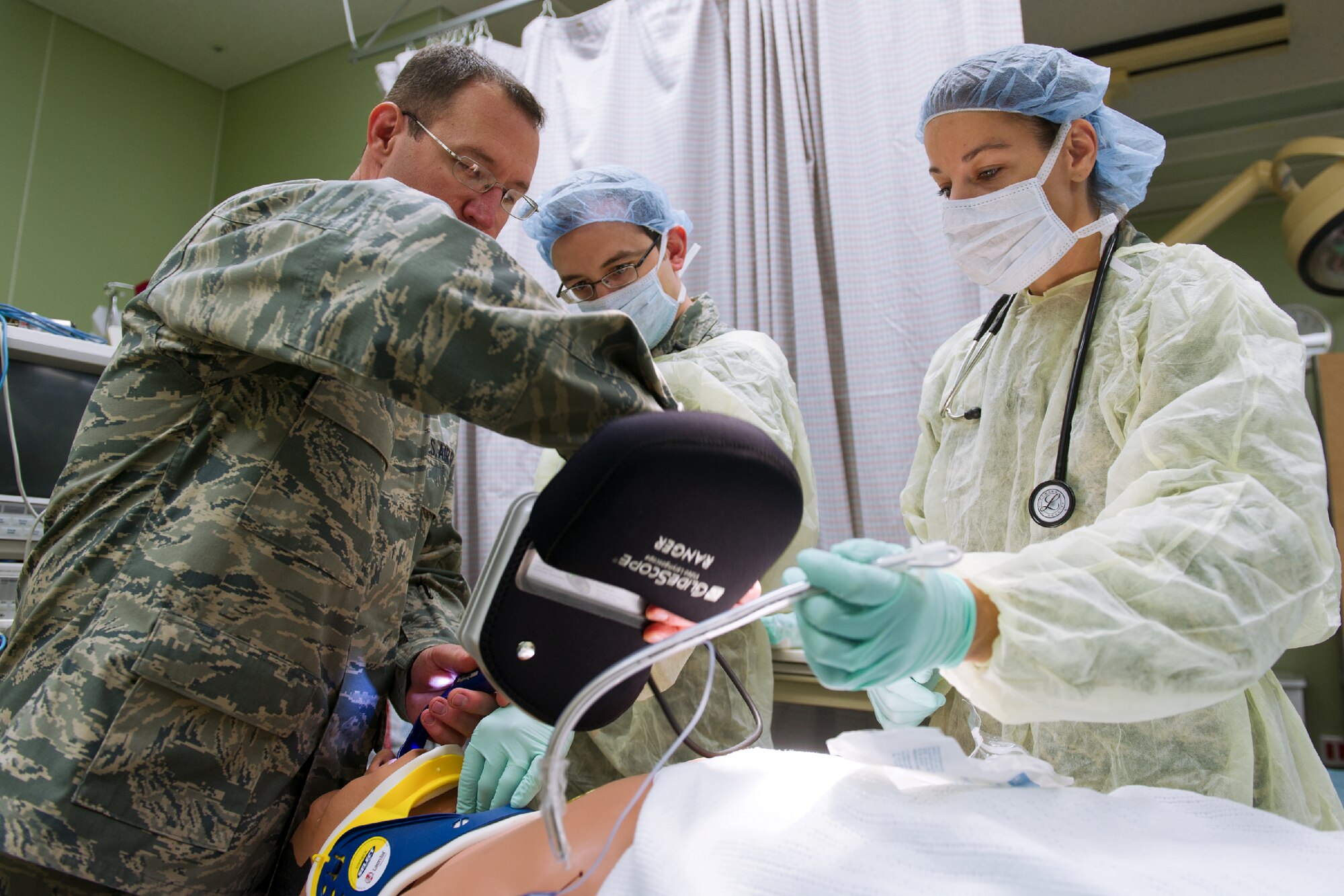 YOKOTA AIR BASE, Japan -- Members from the 374th Surgical Operations Squadron stabilize a simulated patient at Yokota's base hospital, Oct. 29, 2011 during a Tokyo Metropolitan Government Comprehensive Disaster Prevention Drill. Yokota personnel practiced emergency responses with local Hospitals and Japan Ground Self-Defense Force. (U.S. Air Force photo/Osakabe Yasuo)