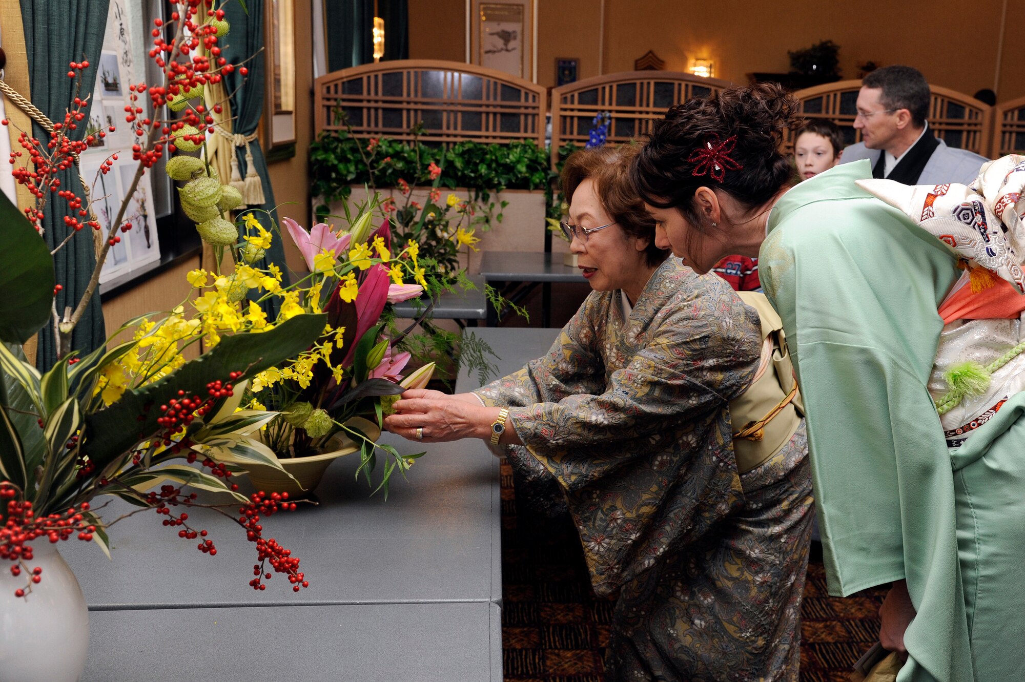 MISAWA AIR BASE, Japan - Jenn Rothstein, wife of Col. Michael D. Rothstein, 35th Fighter Wing commander, admires a flower arrangement during the 24th annual Japan Day here Oct. 29. Japan Day is an opportunity for Misawa residents and their families to immerse themselves in various aspects of the Japanese culture. (U.S. Air Force photo/Tech. Sgt. Marie Brown)