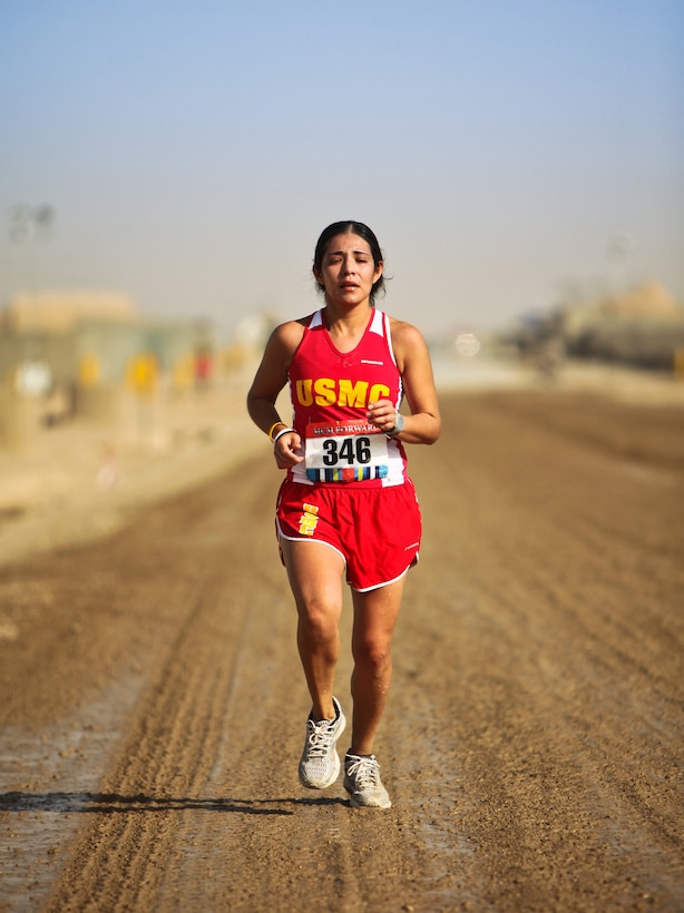 U.S. Navy First Lt. Angelica Valdez completes during the Marine Corps Marathon Forward on Camp Leatherneck in Afghanistan, Oct. 30, 2011. Valdez is an air intelligence officer with Marine Heavy Helicopter Squadron 363, 2nd Marine Air Wing.