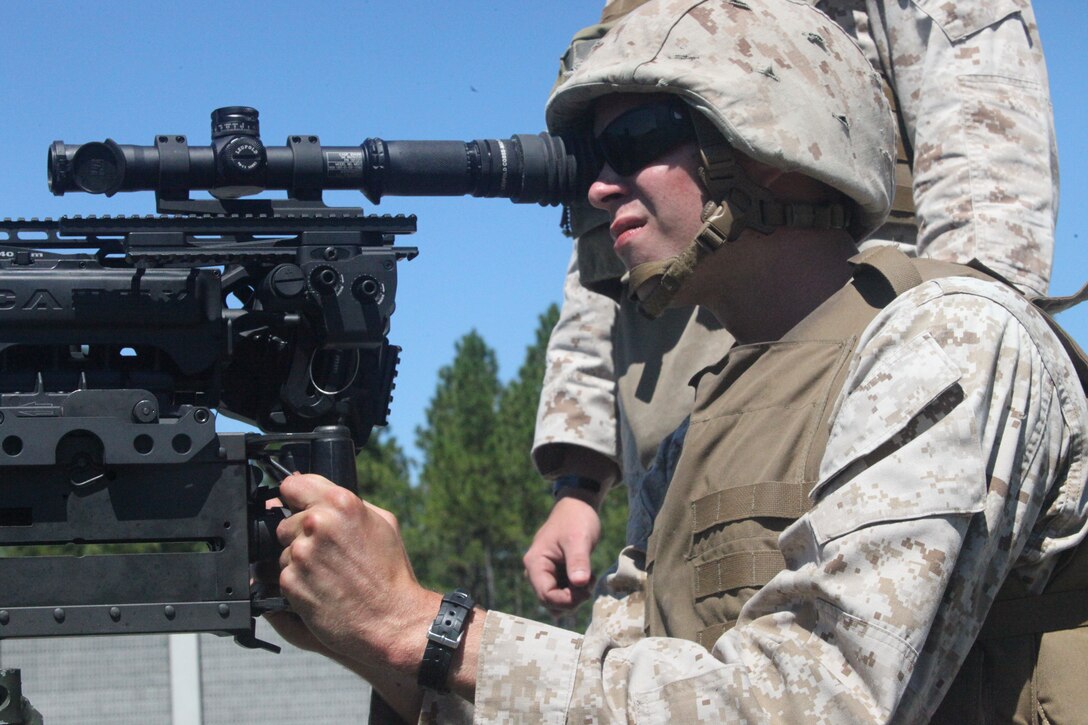 A Marine with Truck Company, Headquarters Battalion, 2nd Marine Division, performed a live fire mounted and moving shoot aboard Marine Corps Camp Lejeune, N.C., Sept. 1, 2011. Marines fired with the .50-caliber and M240 Heavy Machine guns.