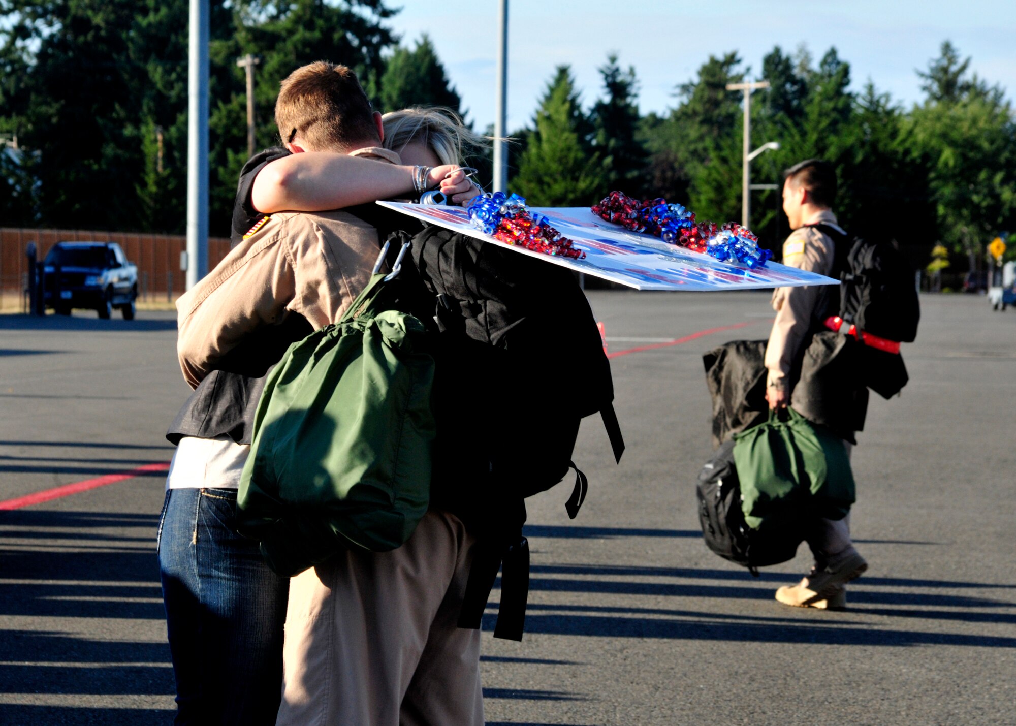 A couple reunites Sept. 1, 2011, at Joint Base Lewis-McChord, Wash., during the return of the 10th Airlift Squadron from a 120-day deployment. The 10th AS was deployed as the 817th Expeditionary Airlift Squadron to an overseas contingency location in the Middle East. (U.S. Air Force Photo/Staff Sgt. Frances Kriss)