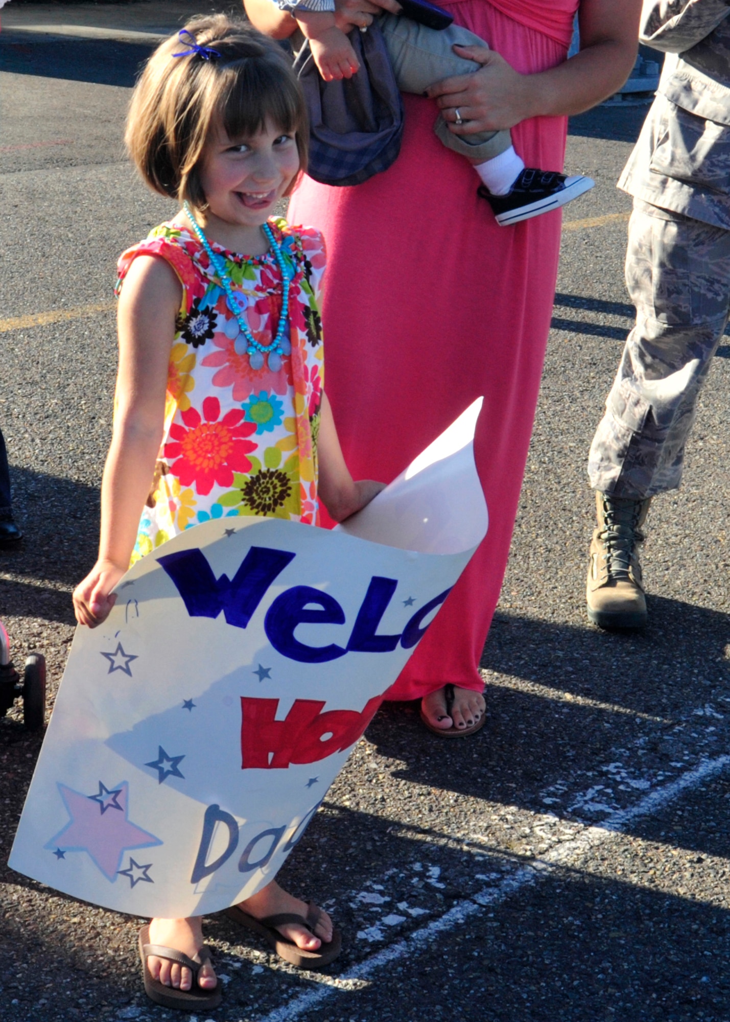 The daughter of Staff Sgt. Sean Sullivan, 10th Airlift Squadron, waits Sept. 1, 2011, at Joint Base Lewis-McChord, Wash., for the return of her dad from a 120-day deployment. The 10th AS was deployed as the 817th Expeditionary Airlift Squadron to an overseas contingency location in the Middle East. (U.S. Air Force Photo/Staff Sgt. Frances Kriss)