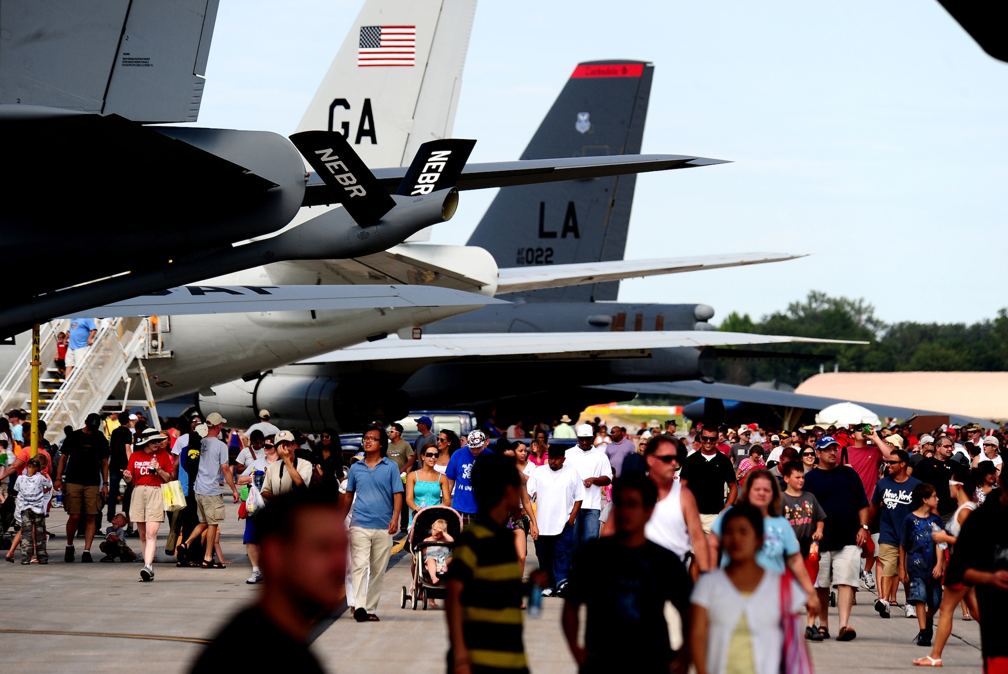 Thousands of people gathered on Offutt Air Force Base's ramp for a chance to tour aircraft while attending the 2011 Defenders of Freedom Open House and Air Show Aug. 27 - 28.  An estimated 110 thousand people flooded Offutt's flightline to view a variety of aircraft from different time periods. (U.S. Air Force photo by Josh Plueger)