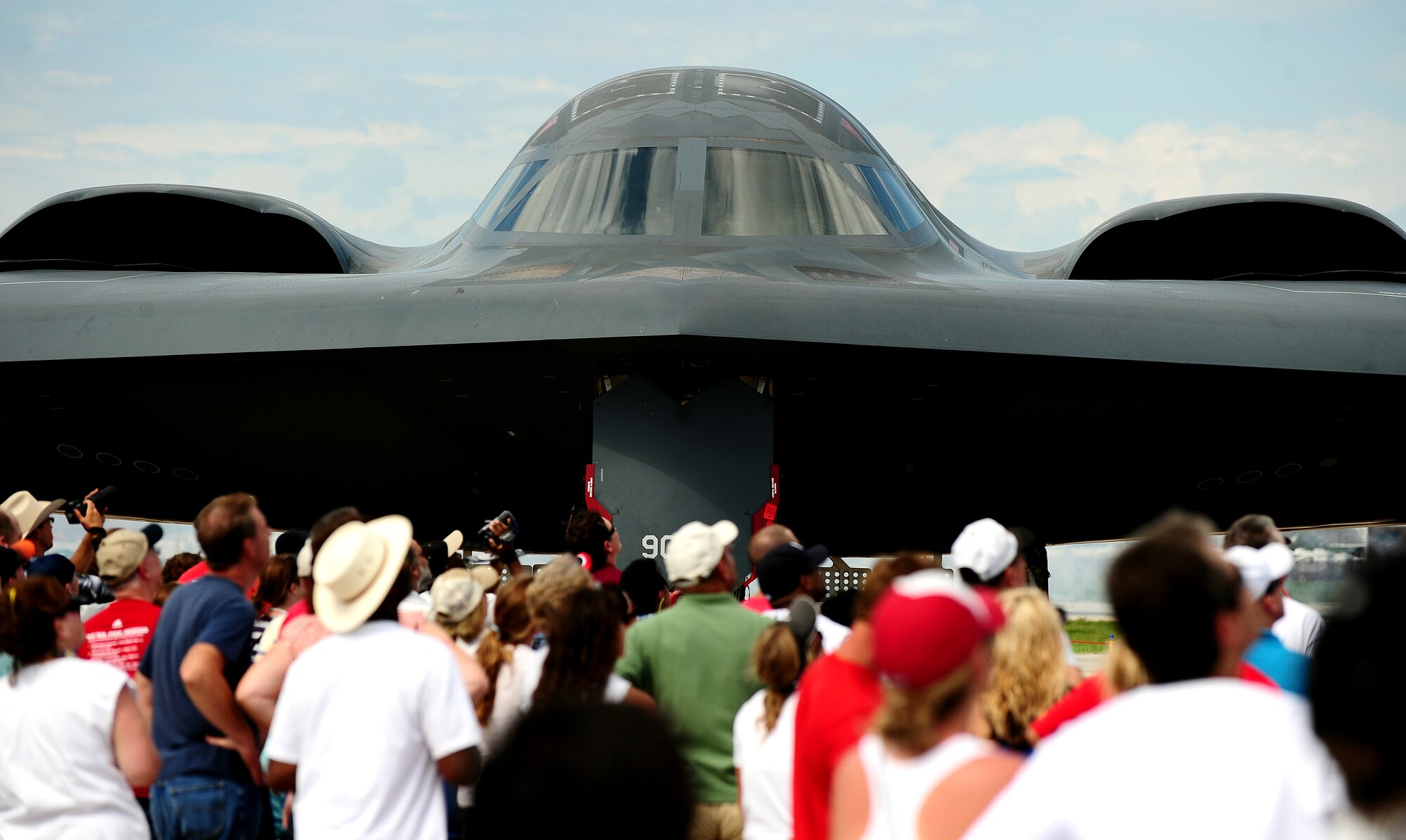 A B-2 Spirit static display was surrounded by admirers at the 2011 Defenders of Freedom Open House and Air Show Aug. 27.  The B-2 has a crew of two pilots, compared to a B-1B crew of four and the B-52's crew of five. (U.S. Air Force photo by Josh Plueger)