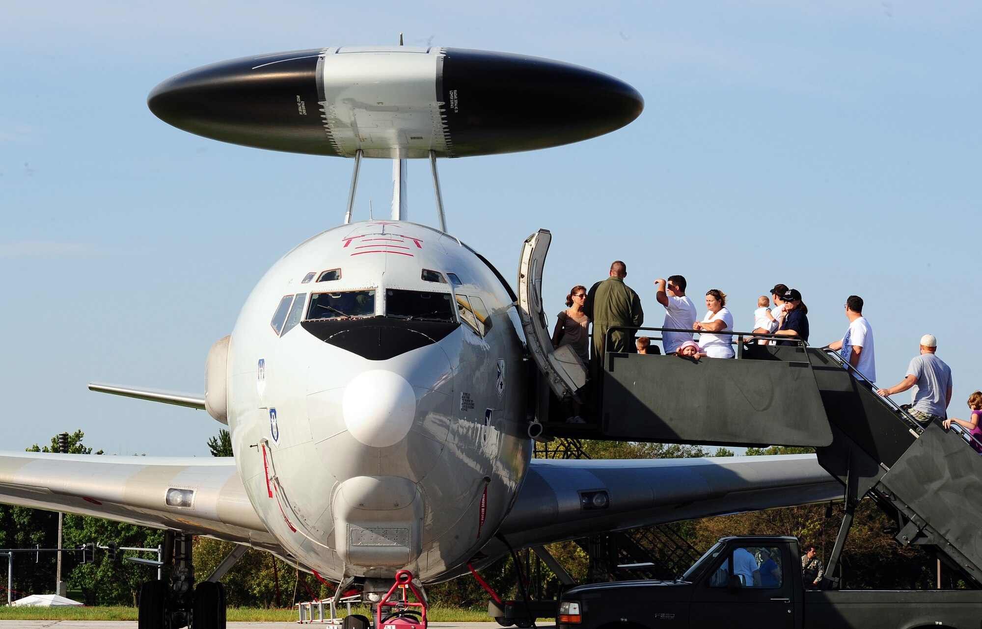 Hundreds of people stood in line to tour an E-3 Sentry airborne warning and control system aircraft at the 2011 Defenders of Freedom Open House and Air Show at Offutt Air Force Base, Neb., Aug. 27 - 28.  The AWACS is a modified Boeing 707/320 commercial airframe that is identified by the 30-foot rotating radar dome held 11 feet above the fuselage by two struts. (U.S. Air Force photo by Josh Plueger)