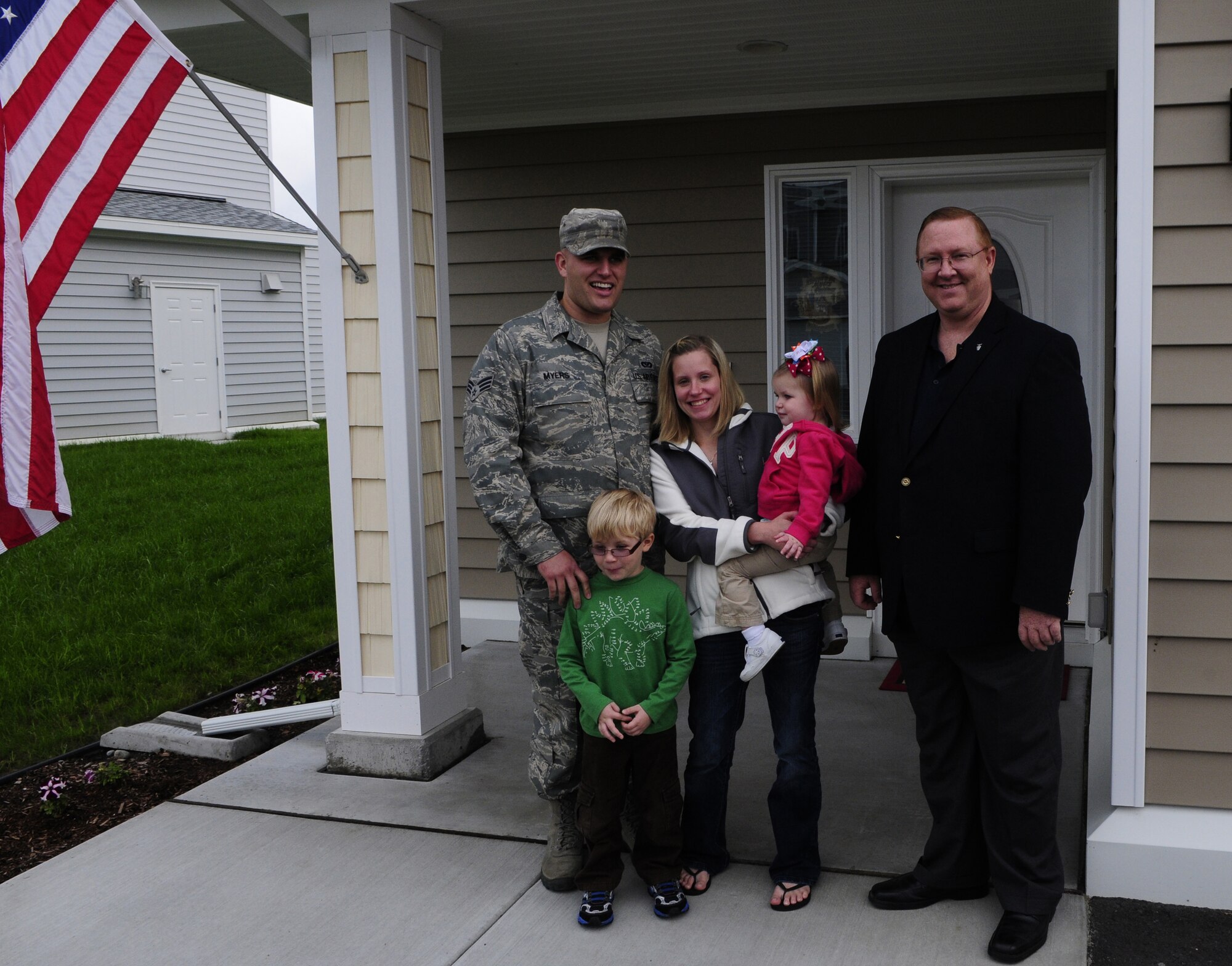 Senior Airman Brett Myers and his family meet Terry Edwards during his tour of base housing here Aug. 24. The Air Force Center for Engineering and Environment director played a large role in Eielson's $270 million housing project estimated for completion in Spring 2012. Airman Myers is a 354th Civil Engineer Squadron construction manager. (U.S. Air Force photo/Airman 1st Class Yash Rojas)