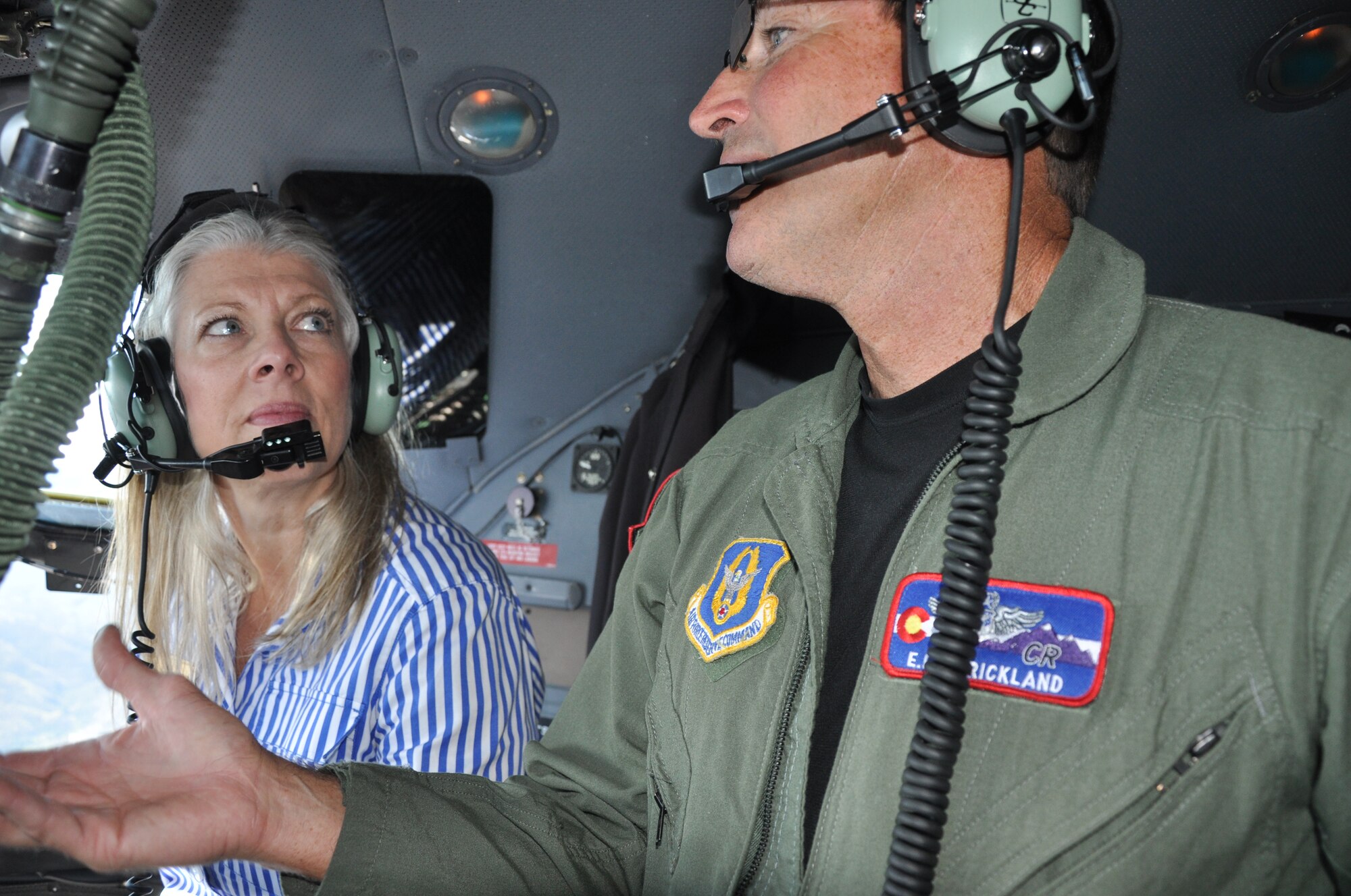 Ms. Renee Doyle, Legislative Assistant for Representative Michele Bachmann, Minnesota-06 learns first-hand about 302nd Airlift Wing's C-130 airlift mission from C-130 navigator, Lt. Col. Ed Strickland. Doyle was a participant in the Aug. 25 Congressional Staff Delegation visit to Colorado. The visit sponsored by the Directorate of Policy Integration, United States Air Force Reserve, helped the participants learn, in-depth, the various roles and missions of the Air Force Reserve. (U.S. Air Force photo/Ann Skarban)