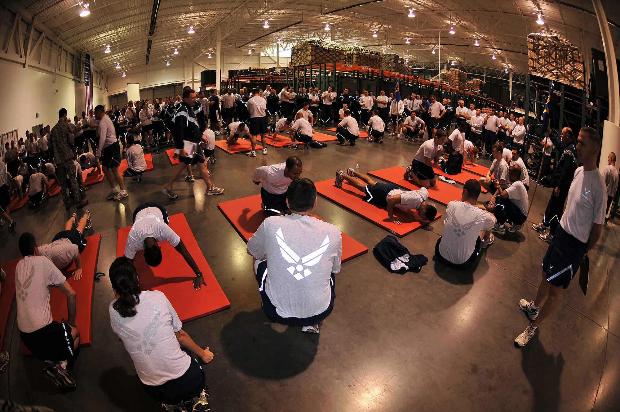 Airmen from the 615th Contingency Response Wing participated in a Chiefs Group push-up and sit-up competition during Wingman Day Aug. 26.  Each of the three groups; 570th Contingency Response Group, 571st Contingency Response Group, 615th Contingency Operations Support Group and the 615th CRW command and staff agencies provided 10 people from each group to do as many push-ups and sit-ups as they could in five minutes.  The grand total was 621 push-ups and 4,638 sit-ups. (U.S. Air Force photo/Tech. Sgt. Lesley Waters)
