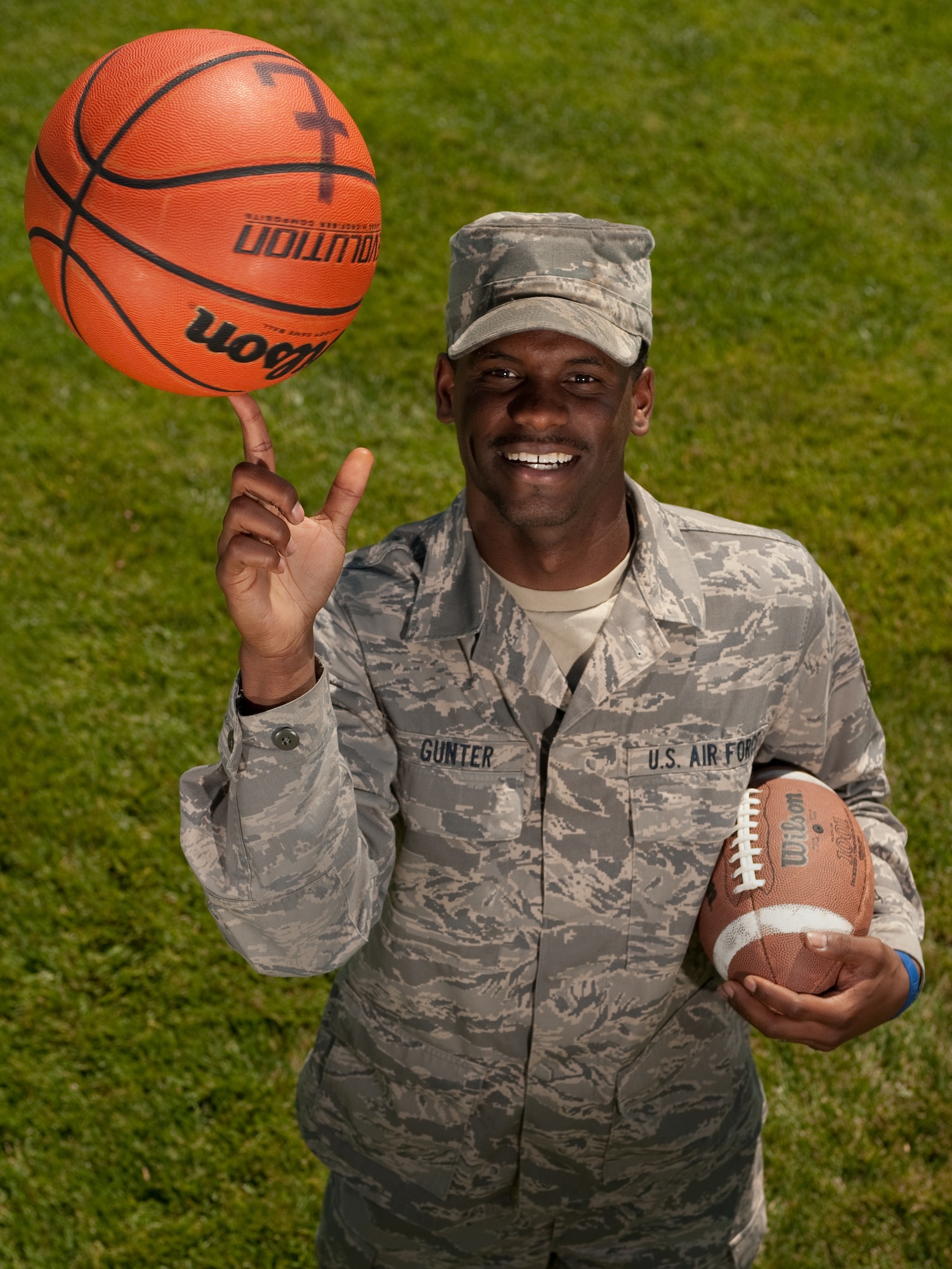 Senior Airman Michael Gunter, 60th Mission Support Group knowledge operator and native of Fort Worth, Texas, poses Wednesday outside his office in building 51 here. Gunter was announced as Travis Athlete of the Year Aug. 24.