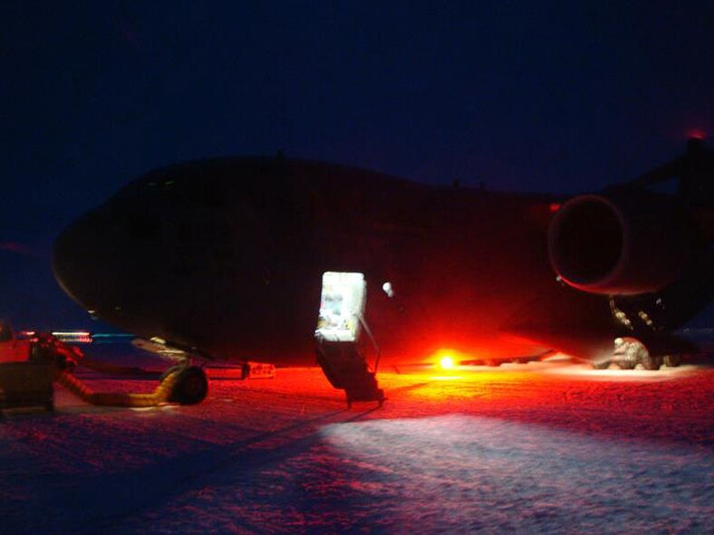 MCMURDO STATION, Antarctica - A C-17 from Joint Base Lewis-McChord, Wash., parks on the ice at McMurdo Station, after deliverying cargo and personnel in one of the first flights of the new season of Operation Deep Freeze. Crews of Reserve and active-duty Airmen from the  446th and 62nd Airlift Wings at JBLM plan to fly 72 missions this season, 10 more than last year. (Courtesy photo)