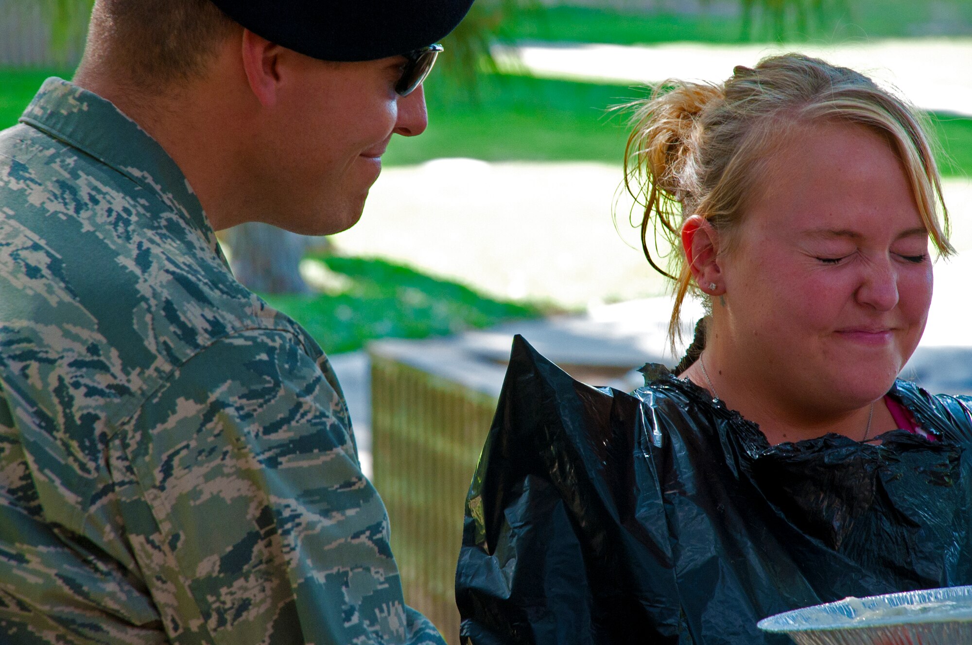 LAUGHLIN AIR FORCE BASE, Texas – Jillian Wilber, 47th Security Forces Squadron, braces herself for a pie in the face by Maj. Ian Walker, 47th SFS commander, here Aug. 26. Laughlin’s Rising Six hosted a pie-in-the-face contest here to raise more than $1,300 that will go towards the upcoming combat dining out. (U.S. Air Force photo/Senior Airman Scott Saldukas) 