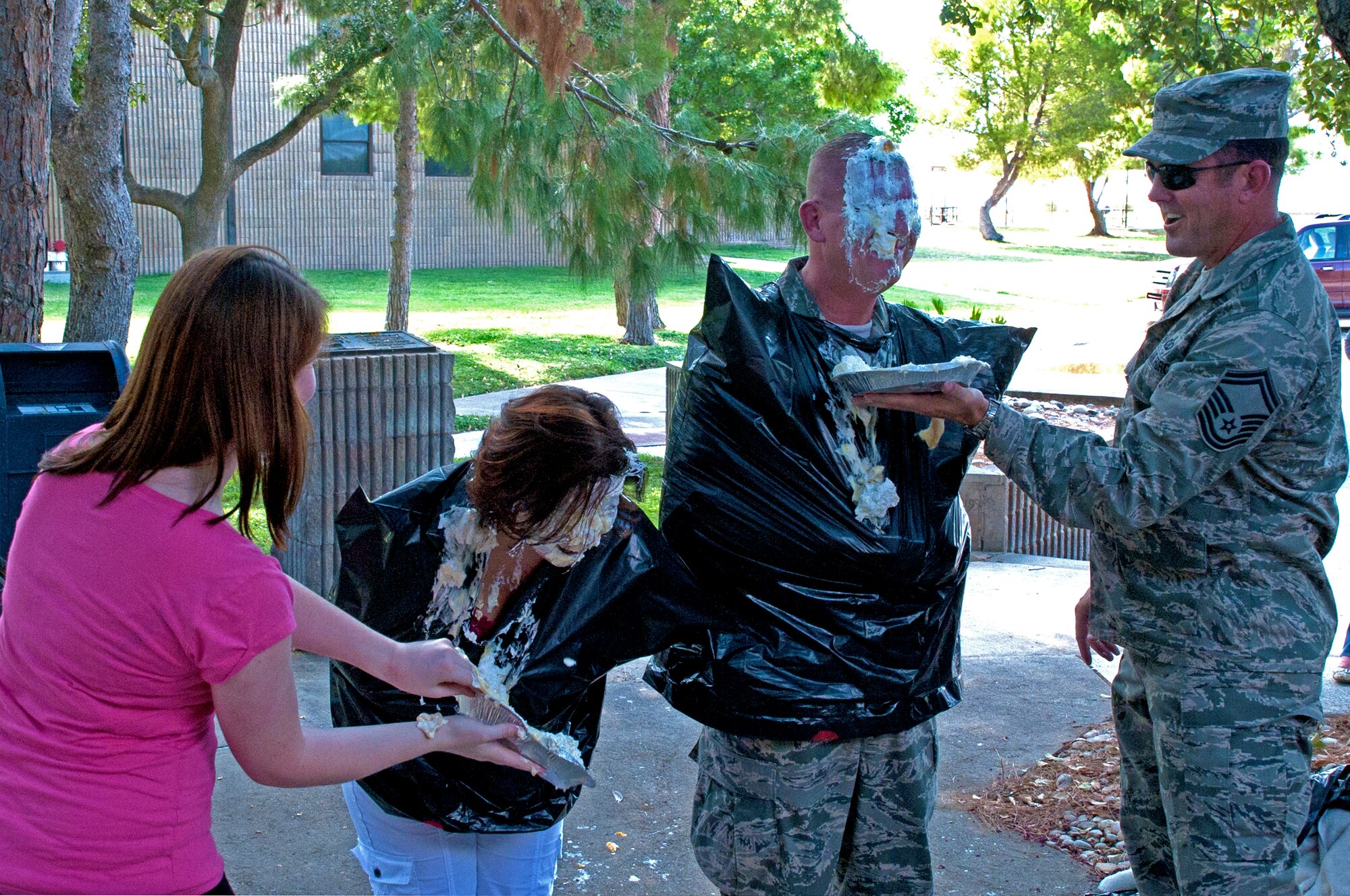 LAUGHLIN AIR FORCE BASE, Texas – Master Sgt. Sandra Krueger, 47th Medical Support Squadron, and Chief Master Sgt. Michael Ogden, 47th Mission Support Group superintendant, get pied in the face Aug. 26. Laughlin’s Rising Six hosted a pie-in-the-face contest here to raise more than $1,300 that will go towards the upcoming combat dining out. (U.S. Air Force photo/Senior Airman Scott Saldukas) 