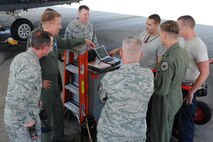 Airman 1st Class Shane Washburn, 4th Aircraft Maintenance Unit crew chief, points out instructions on a technical order on the flightline on Seymour Johnson Air Force Base, N.C., Aug. 31, 2011. Maj. Gen. Stephen Hoog, 9th Air Force commander, visits Airmen on the job around base. Washburn hails from Duluth, Minn. (U.S. Air Force photo by Senior Airman Whitney Lambert/Released)