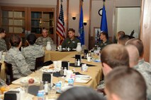 Command Chief Master Sgt.  Robert Brooks of the 9th Air Force talks to approximately 40 Airmen over breakfast at the Southern Eagle Dining Facility on Seymour Johnson Air Force Base, Aug. 31, 2011. Brooks points out the importance of following and enforcing the Air Force core values for a successful career. (U.S. Air Force photo by Senior Airman Whitney Lambert/Released)