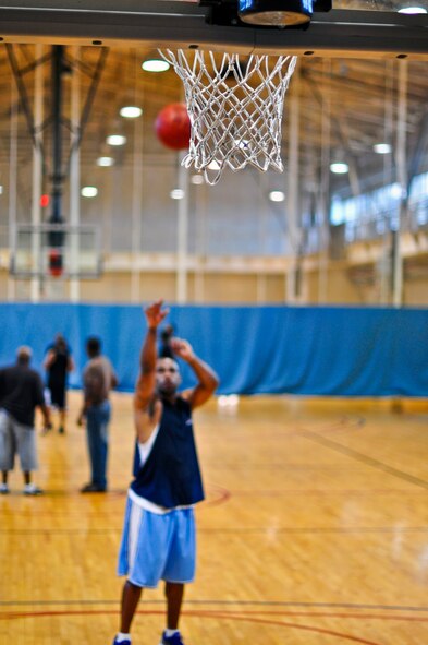 Tryouts for the men's base basketball team continue Aug. 27 and 28 in the base gym. The coaches ran the players through basic offensive and defense drills. For those interested in trying out for the team call the fitness center at 784-5568. (U.S. Air Force photo/Tech. Sgt. Chad Thompson)