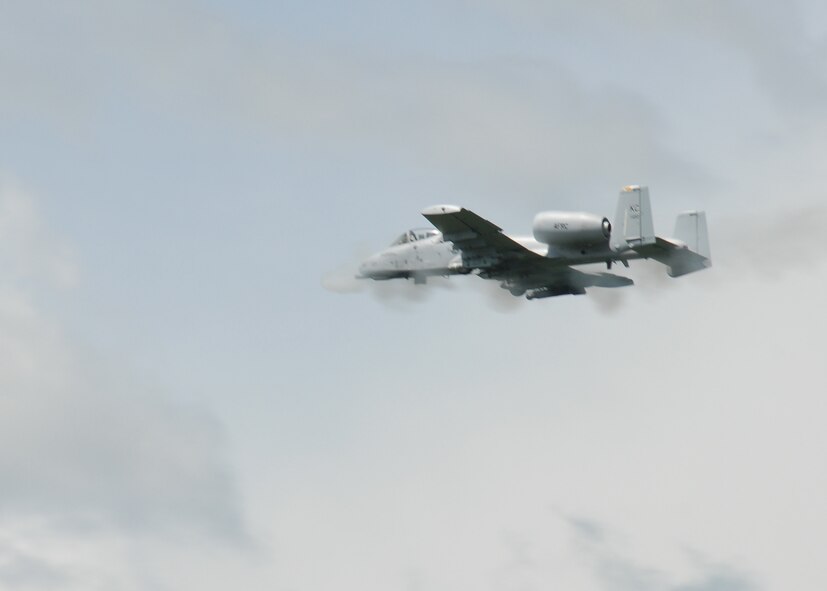 An A-10 Thunderbolt II close air support/ground attack aircraft uses its rotary cannon during a training manuever over the 131st Bomb Wing Detachment 1 Cannon Range, Laquey, MO.  F-16 Fighting Falcons, and B-2 Spirit bombers will also be performing training missions during the Cannon Range Open House on Sept 10.  (Photo by Master Sgt. Mary-Dale Amison) 