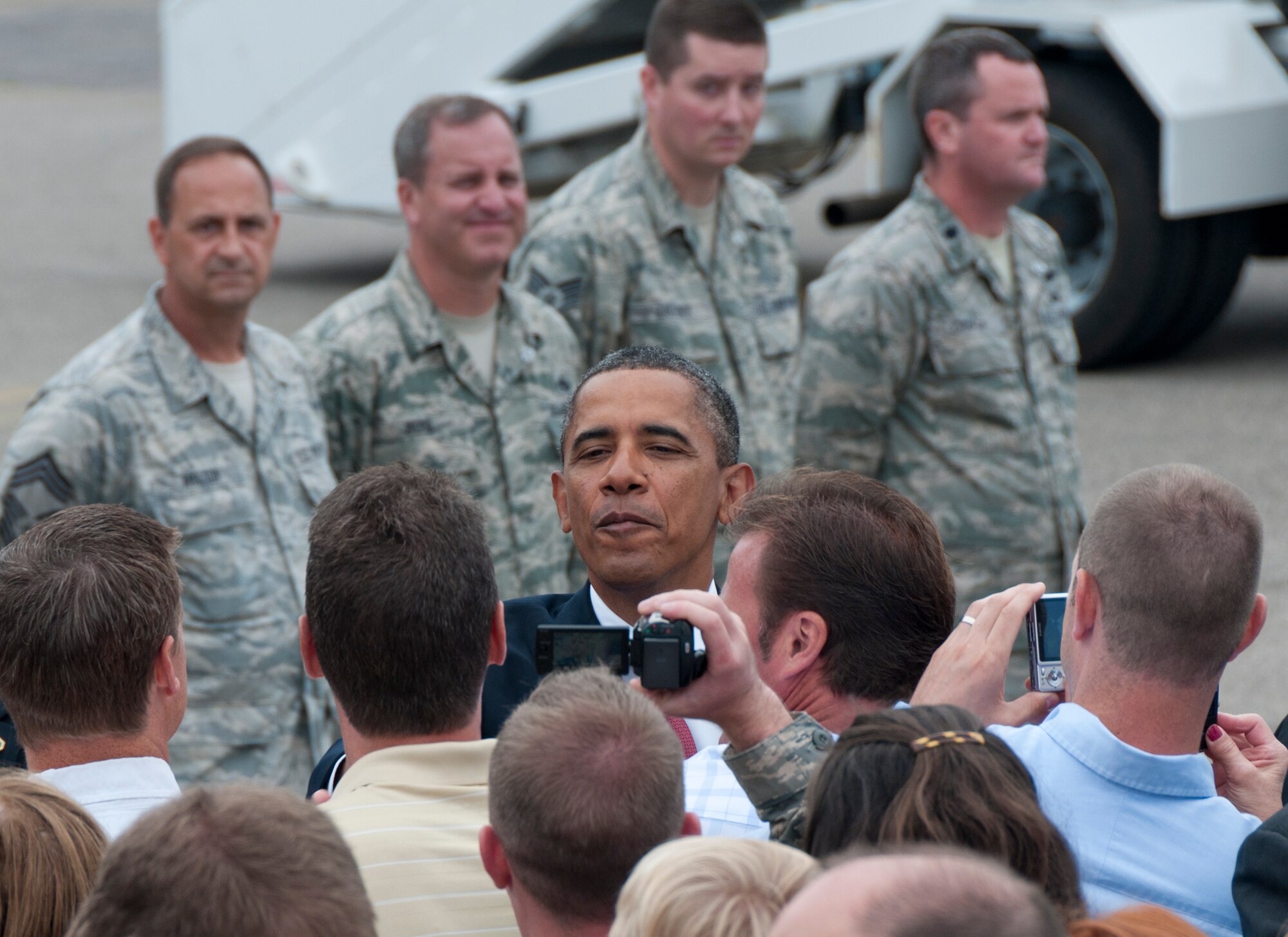 President Barack Obama greets well-wishers as he steps off Air Force One on the ramp of the 133rd Airlift Wing at the Minneapolis-St. Paul International Airport on August 30, 2011. The president is in the Twin Cities to deliver a speech to the American Legion Annual Conference. The visit is heavily supported with security, logistics, media and other support by the Airmen of the 133rd Airlift Wing. USAF official photo by Senior Master Sgt. Mark Moss