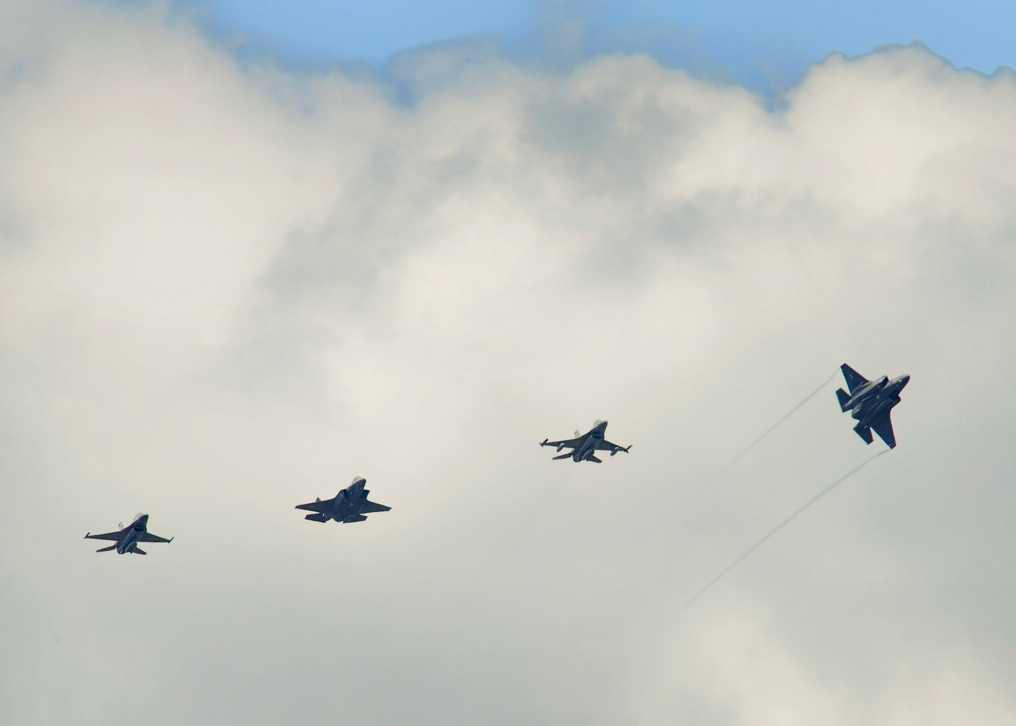 Two F-35A Lightning II joint strike fighters were delivered to Eglin Air Force Base, Fla., with 33rd Fighter Wing-piloted F-16 Fighting Falcons escorting the jets to their new home Aug. 31, 2011. Labeled as AF-10 and AF-11 by Lockheed Martin, the JSFs bring the total count of the fifth-generation fighter aircraft at Eglin AFB to four. (U.S. Air Force photo/Staff Sgt. Joely Santiago)