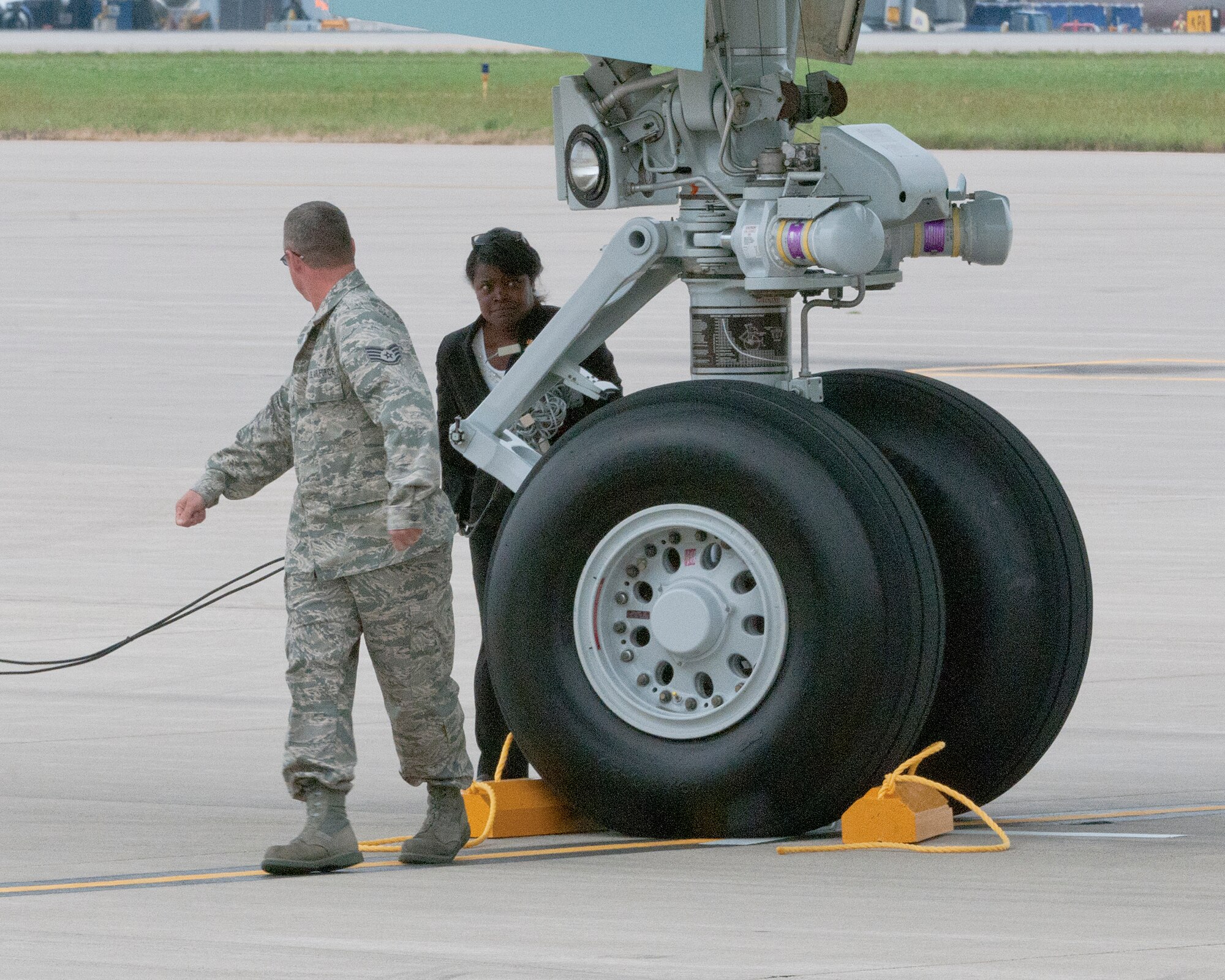 Staff Sgt. Patrick Koss of the 133rd Aircraft Maintenance Squadron checks the chocks he just placed under the wheel of Air Force One on the ramp of the 133rd Airlift Wing at the Minneapolis-St. Paul International Airport on August 30, 2011. The VC-25A, which is a highly customized Boeing 747-200B, arrived at the Minnesota Air National Guard base bringing President Barack Obama, the commander-in-chief, to the Twin Cities where he delivered a speech to the American Legion Annual Conference. The visit is heavily supported with security, logistics, media and other support by the Airmen of the 133rd Airlift Wing. USAF official photo by Senior Master Sgt. Mark Moss