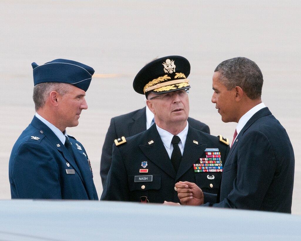 The commander-in-chief, President Barack Obama, takes a moment to talk with Maj. Gen. Rick Nash, Minnesota’s Adjutant General (center) and Col. Greg Haase, commander of the 133rd Airlift Wing as he steps off Air Force One on the ramp of the 133rd Airlift Wing at the Minneapolis-St. Paul International Airport on August 30, 2011. The president is in the Twin Cities where he delivered a speech to the American Legion Annual Conference. The visit is heavily supported with security, logistics, media and other support by the Airmen of the 133rd Airlift Wing. USAF official photo by Senior Master Sgt. Mark Moss