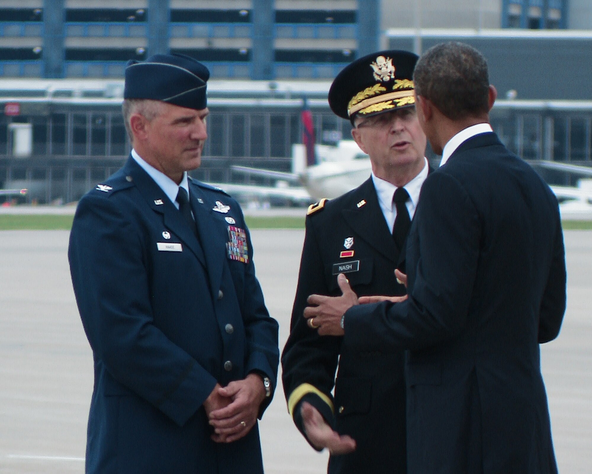 The commander-in-chief, President Barack Obama, takes a moment to talk with Maj. Gen. Rick Nash, Minnesota’s Adjutant General (center) and Col. Greg Haase, commander of the 133rd Airlift Wing as he steps off Air Force One on the ramp of the 133rd Airlift Wing at the Minneapolis-St. Paul International Airport on August 30, 2011. The president is in the Twin Cities where he delivered a speech to the American Legion Annual Conference. The visit is heavily supported with security, logistics, media and other support by the Airmen of the 133rd Airlift Wing. USAF official photo by Master Sgt. David Fenner