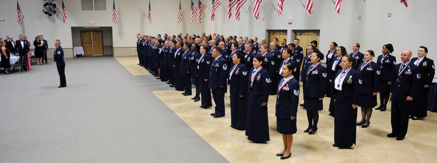 Barksdale Airmen sing the Air Force Song during a Senior NCO Induction Ceremony on Barksdale Air Force Base, La., Aug. 26. The Base Top III hosted the 2011 SNCO Induction Ceremony for 84 Master Sergeant Selects across Team Barksdale. Thirty-nine other selectees could not attend due to worldwide deployments. (U.S. Air Force photo/Airman 1st Class Micaiah Anthony)(RELEASED)