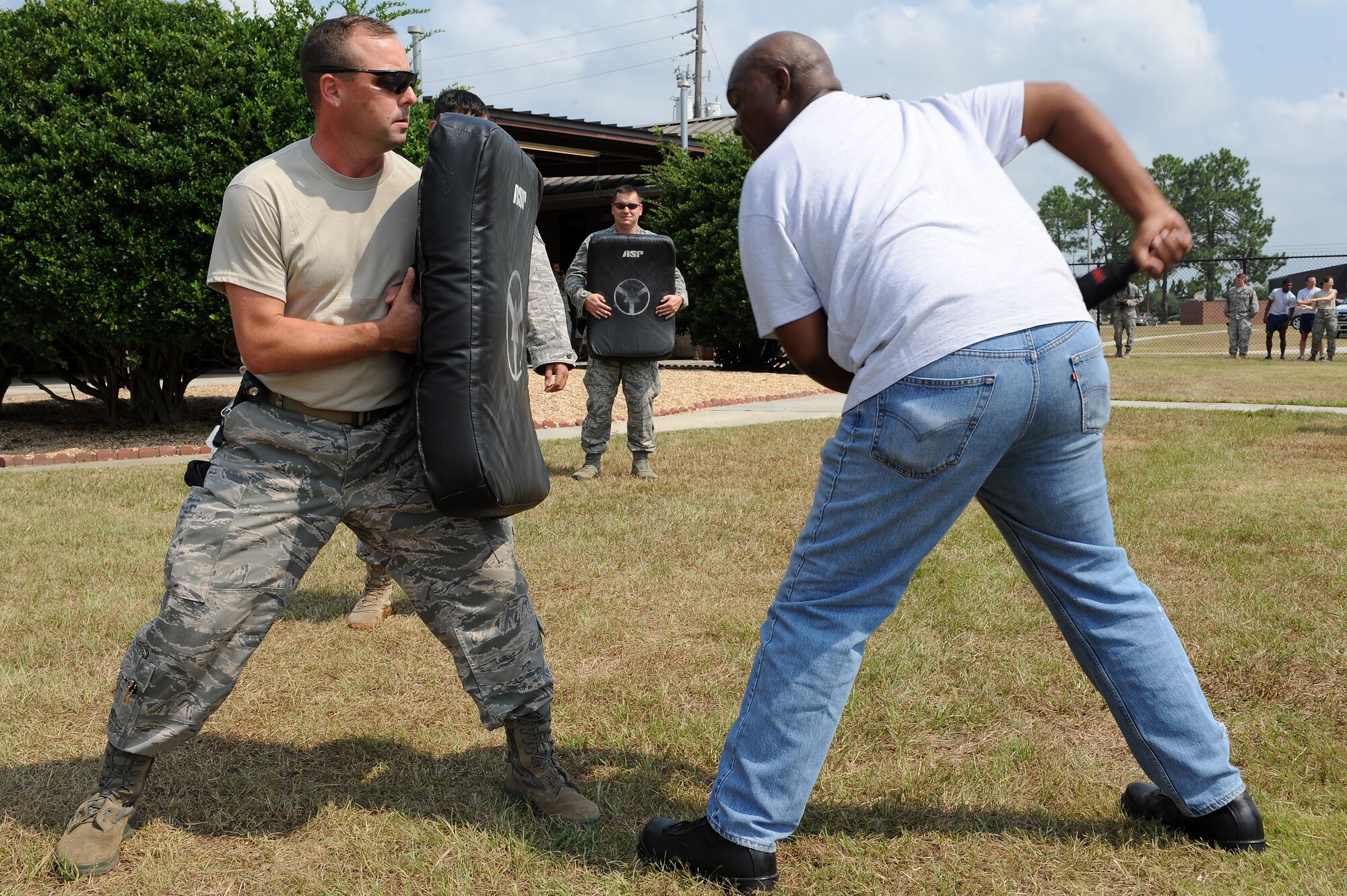 U.S. Air Force Tech. Sgt. Randy Dauzat, 23rd Security Forces Squadron (SFS) kennel master, holds a defensive fighting position as Edwin Byrd, gate guard, practices jabbing at Moody Air Force Base, Ga., Aug. 31, 2011.
The 23rd SFS conducted pepper spray training to familiarize Airmen with the effects of pepper spray if applied to an aggressor. (U.S. Air Force photo by Senior Airman Ciara Wymbs/Released)
