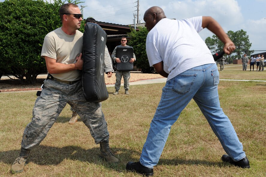 U.S. Air Force Tech. Sgt. Randy Dauzat, 23rd Security Forces Squadron (SFS) kennel master, holds a defensive fighting position as Edwin Byrd, gate guard, practices jabbing at Moody Air Force Base, Ga., Aug. 31, 2011.
The 23rd SFS conducted pepper spray training to familiarize Airmen with the effects of pepper spray if applied to an aggressor. (U.S. Air Force photo by Senior Airman Ciara Wymbs/Released)
