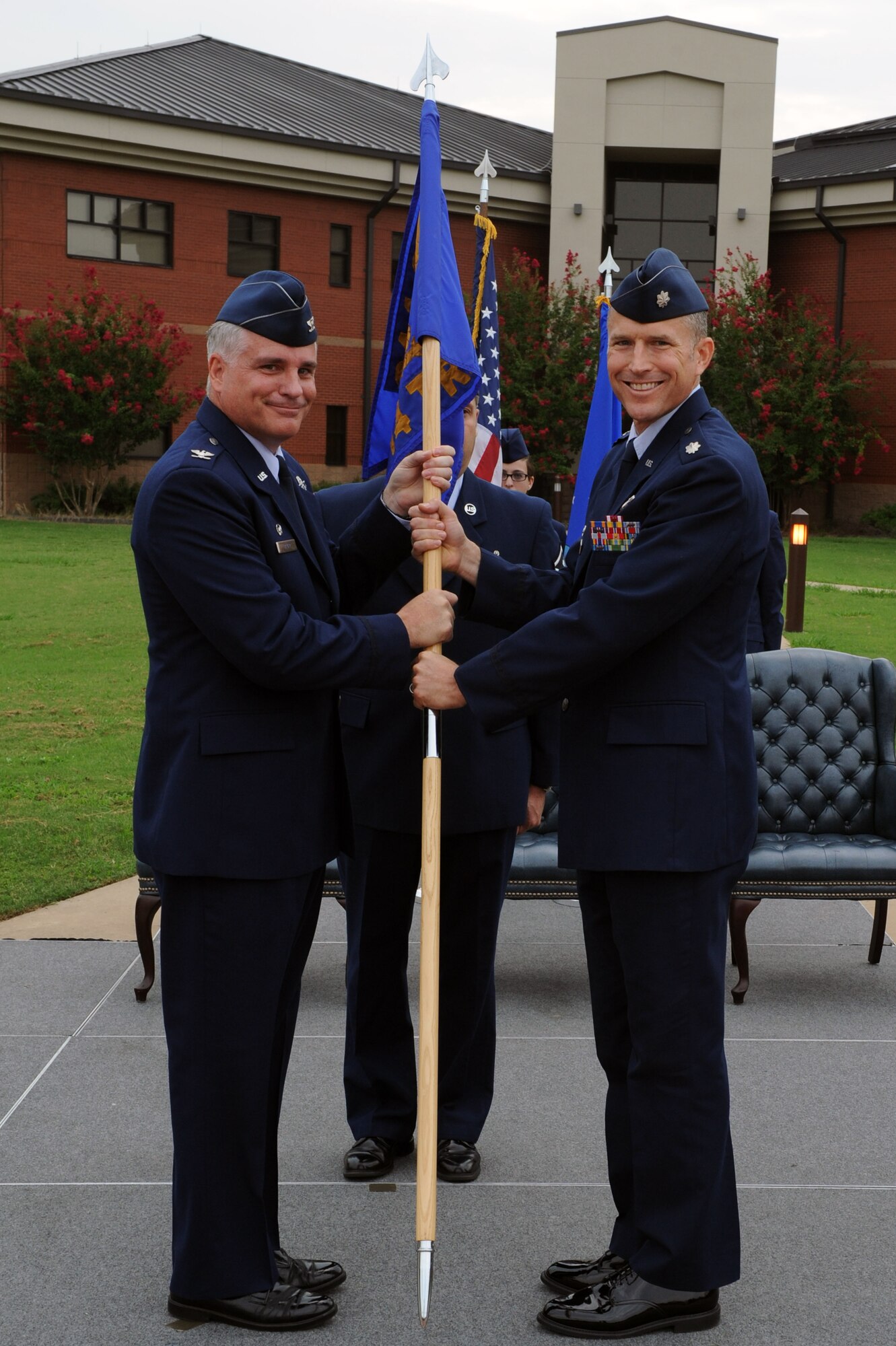 Lt. Col. Jonathan Steckbeck (right), 714th Training Squadron commander, accepts the guidon from Col. Michael Bauer, 314th Operations Group commander, during a change of command ceremony, Aug. 31, 2011, at Little Rock Air Force Base, Ark. The mission of the 714th TRS is to train aircrew students and perform student support functions for the largest C-130 base in the world. (U.S. Air Force photo by Airman 1st Class Rusty Frank)
