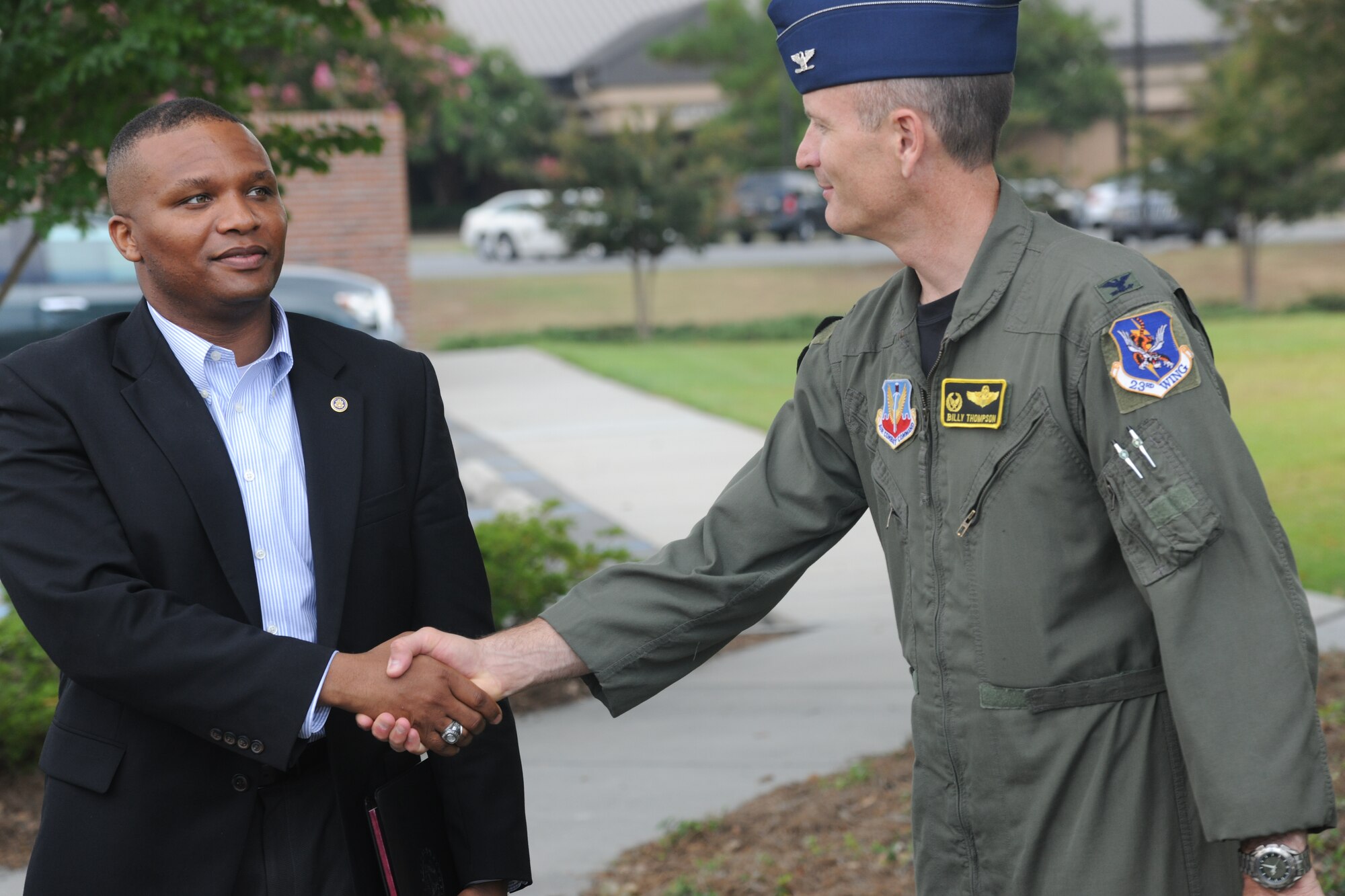 Julius Spain, Office of Senator Johnny Isakson, Defensive Legislative Fellow, shakes hands with U.S. Air Force Col. Billy Thompson, 23rd Wing commander, at Moody Air Force Base, Ga., Aug. 31, 2011. Spain was one of five delegates who visited Moody to take a tour and view the base’s capabilities. (U.S. Air Force photo by Airman 1st Class Paul Francis/Released)

