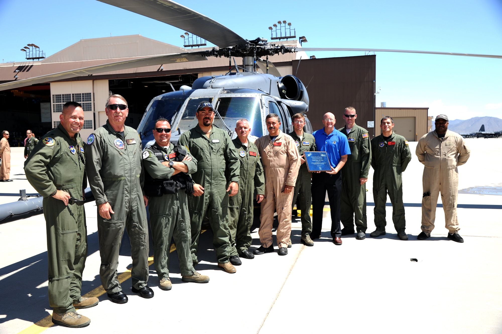 KIRTLAND AFB, N.M. -- Two 58th Special Operations Wing helicopters reached an aviation milestone here Tuesday, when the HH-60G Pave Hawks surpassed 10,000 hours of flying time. Pictured here are the flight crews from the historic 10,000 hours on the air frame for aircraft tail numbers 82680 and 82644. (photo by Edward C. Harrison)