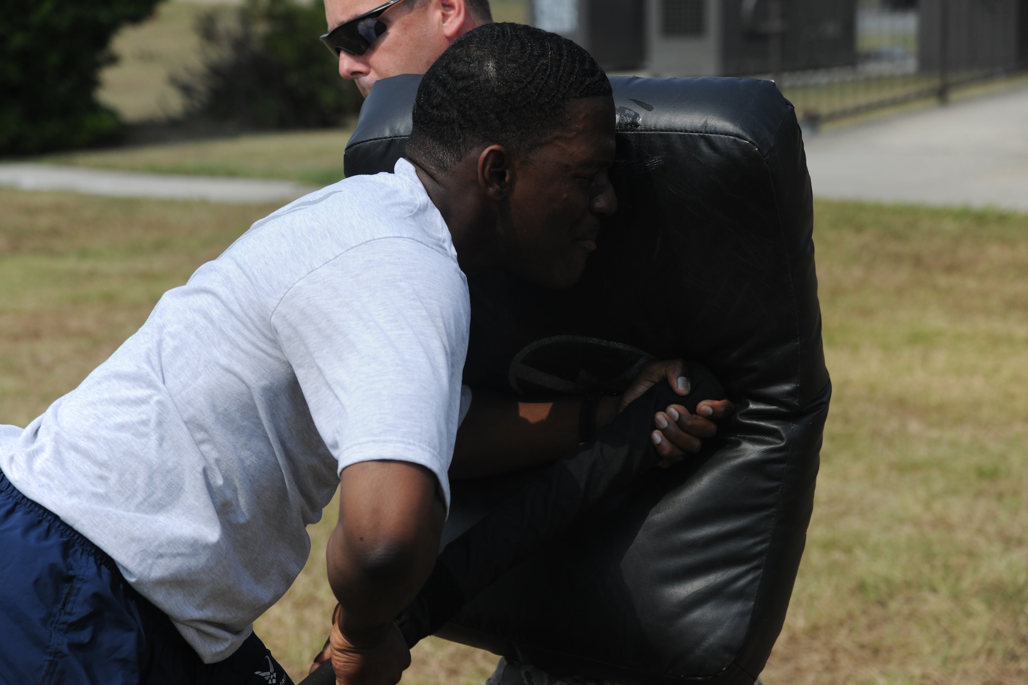 U.S. Air Force Staff Sgt. Lawrence Danner, 23rd Security Force Squadron patrol leader, goes through one of five combat stations after being sprayed with oleoresin capsicum or pepper spray at Moody Air Force Base, Ga., Aug. 31, 2011. Training consisted of four different striking maneuvers and one blocking technique which each lasted 20 seconds. U.S. Air Force photo by Airman 1st Class Paul Francis/Released)
