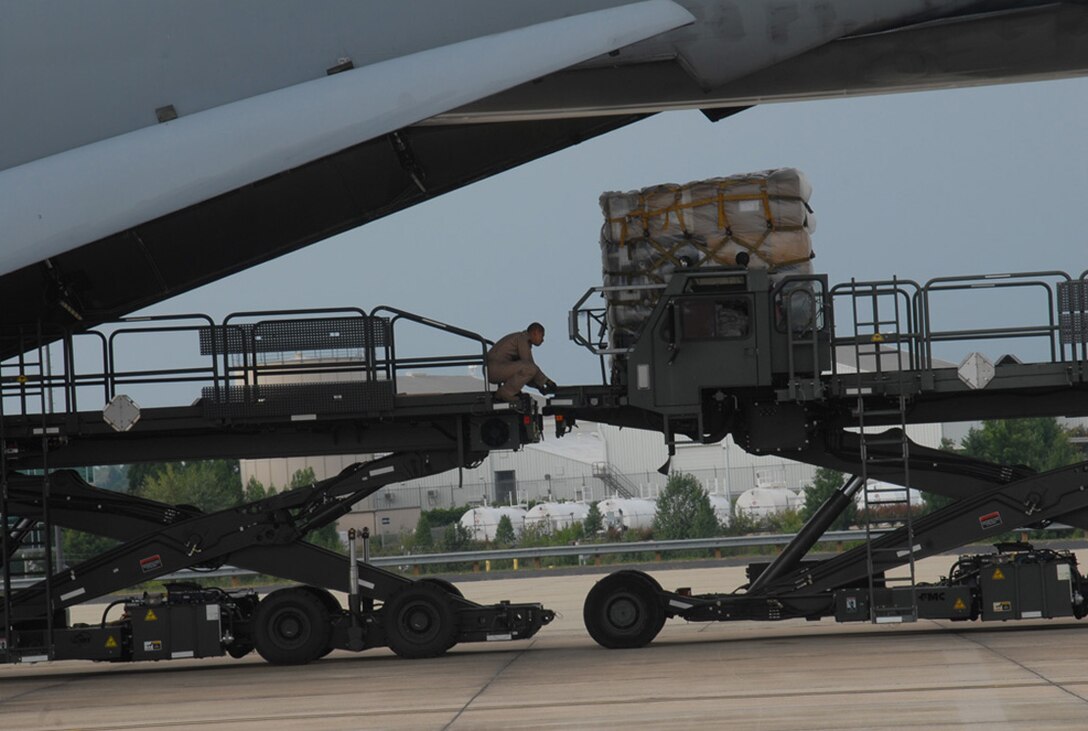 Members of the 263rd Combat Communications Squadron, located in New London, N.C. deployed to Southwest Asia August 29.  Part of the North Carolina ANG’s 145th Airlift Wing, based in Charlotte, N.C., the group departed from Charlotte ANG Base on a C-5 Galaxy aircraft with supplies to assist in the creation of base infrastructure at an undisclosed location.  Photos here depict the loading and boarding processes prior to departure.