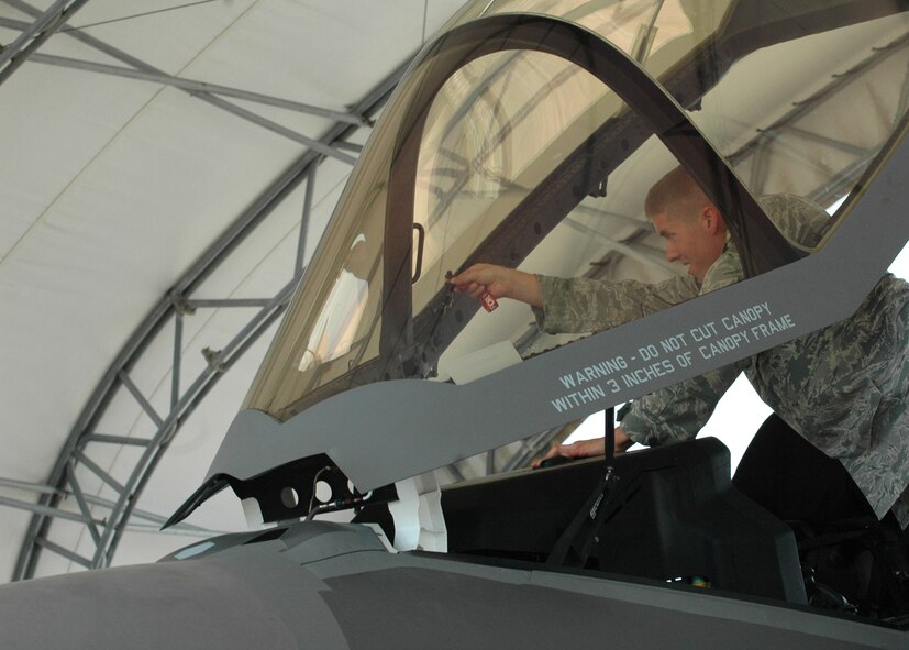 Senior Airman Arthur Verchot prepares an F-35 Lightning II cockpit for tow operations, part of his duties as one of the few trained in recovering the Air Force's newest aircraft at the 33rd Aircraft Maintenance Squadron. The aircraft his team recovered was for the fourth delivery of the joint strike fighter to the 33rd Fighter Wing. With the assistance of Lockheed Martin logistics support, two Air Force three-man recovery teams are currently trained to support aircraft arrival with an additional fourteen Airmen trained in towing the jet. (U.S. Air Force photo/Chrissy Cuttita)