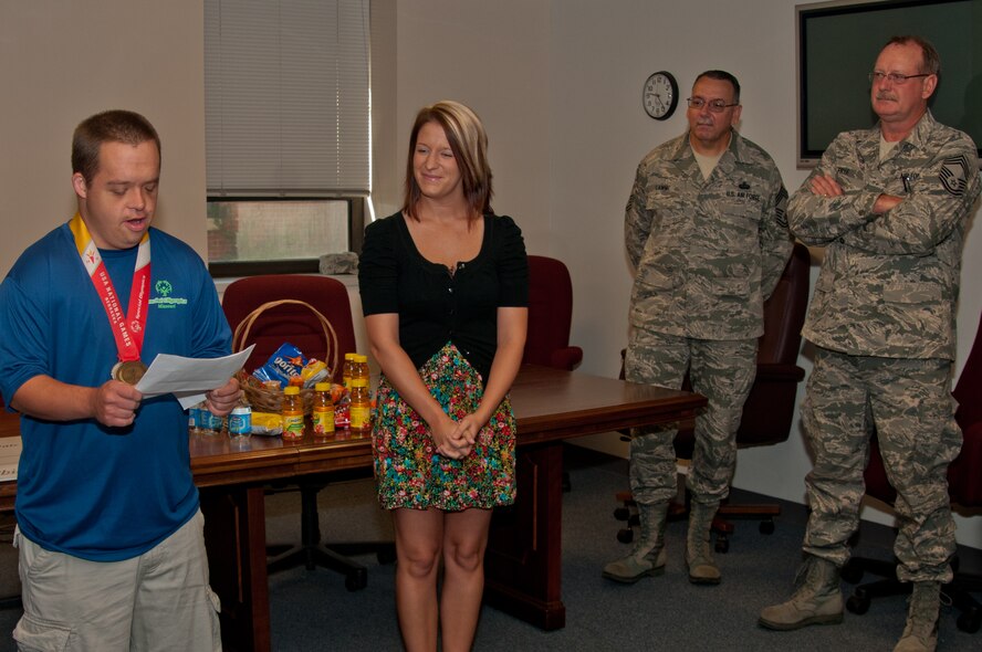 Members of the 139th Airlift Wing Chief’s Association, Missouri Air National Guard, present a check to Special Olympics Missouri Northwest, at Rosecrans Memorial Airport in Saint Joseph, Mo., on August 31, 2011. The proceeds were raised at the annual Chiefs and Family Readiness golf tournament earlier in the year. (U.S. Air Force photo by Senior Airman Sheldon Thompson)