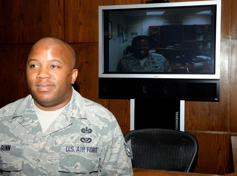 Staff Sgt. Geoffery Gunn, 2nd Bomb Wing Legal Office, poses with his sister, Capt. Capri Baptiste, after his technical sergeant promotion ceremony on Barksdale Air Force Base, La., Aug. 31. In addition to Baptiste, Gunn's wife, daughter and parent's attended the ceremony. (U.S. Air Force photo/Staff Sgt. Terri Barriere) (RELEASED)