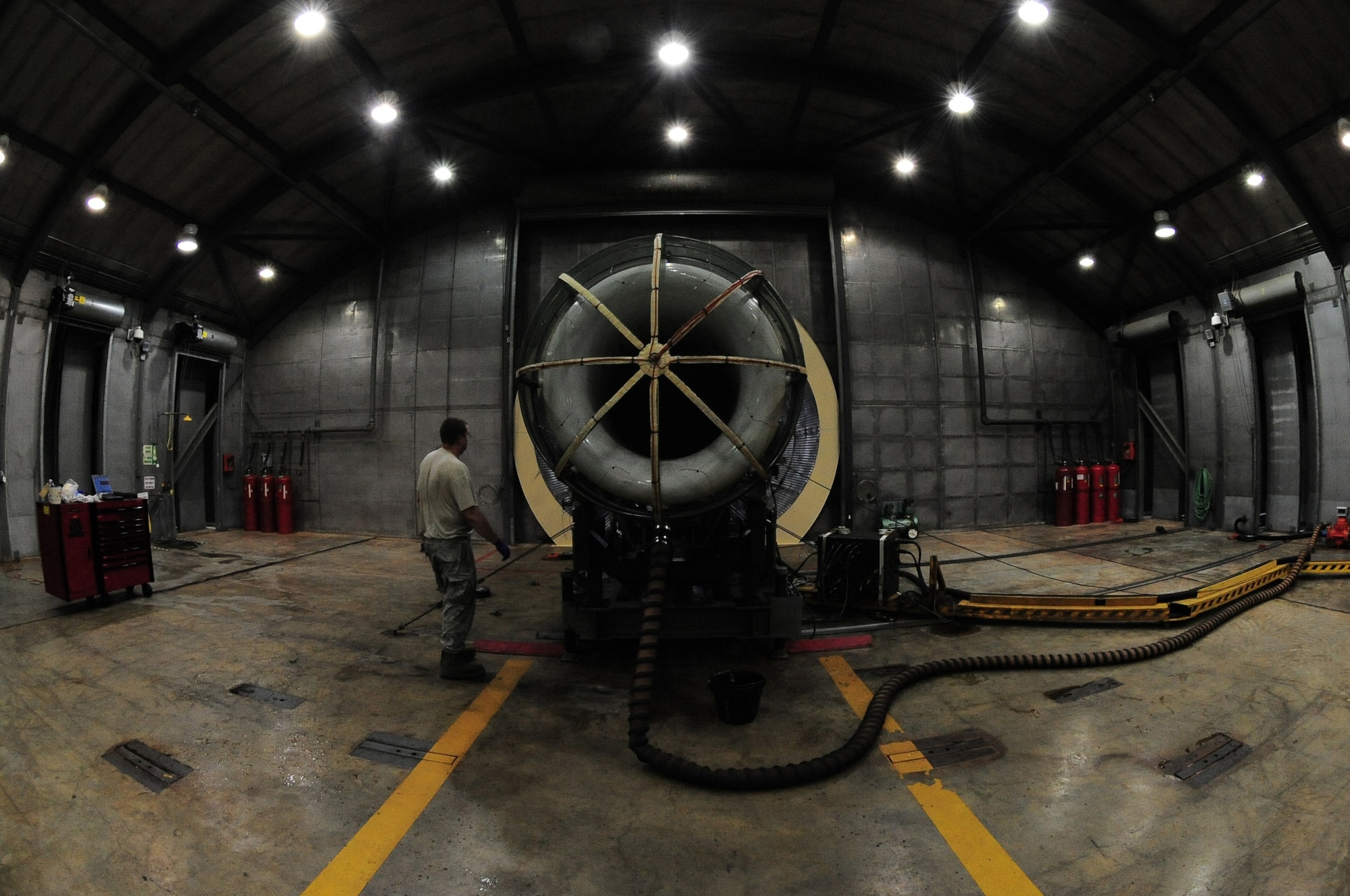 U.S. Air Force Staff Sgt. Todd Goucher, 20th Component Maintenance Squadron test cell technician, ensures everything is connected properly on an F-16 engine before an engine test run at the engine test facility at Shaw Air Force Base, S.C, Aug. 28, 2011. The engine is test facility, also known as the "hush house" is designed to absorb the noise created by jet engines so not to bother the neighboring community.(U.S. Air Force photo/Airman 1st Class Daniel Phelps)(Released)