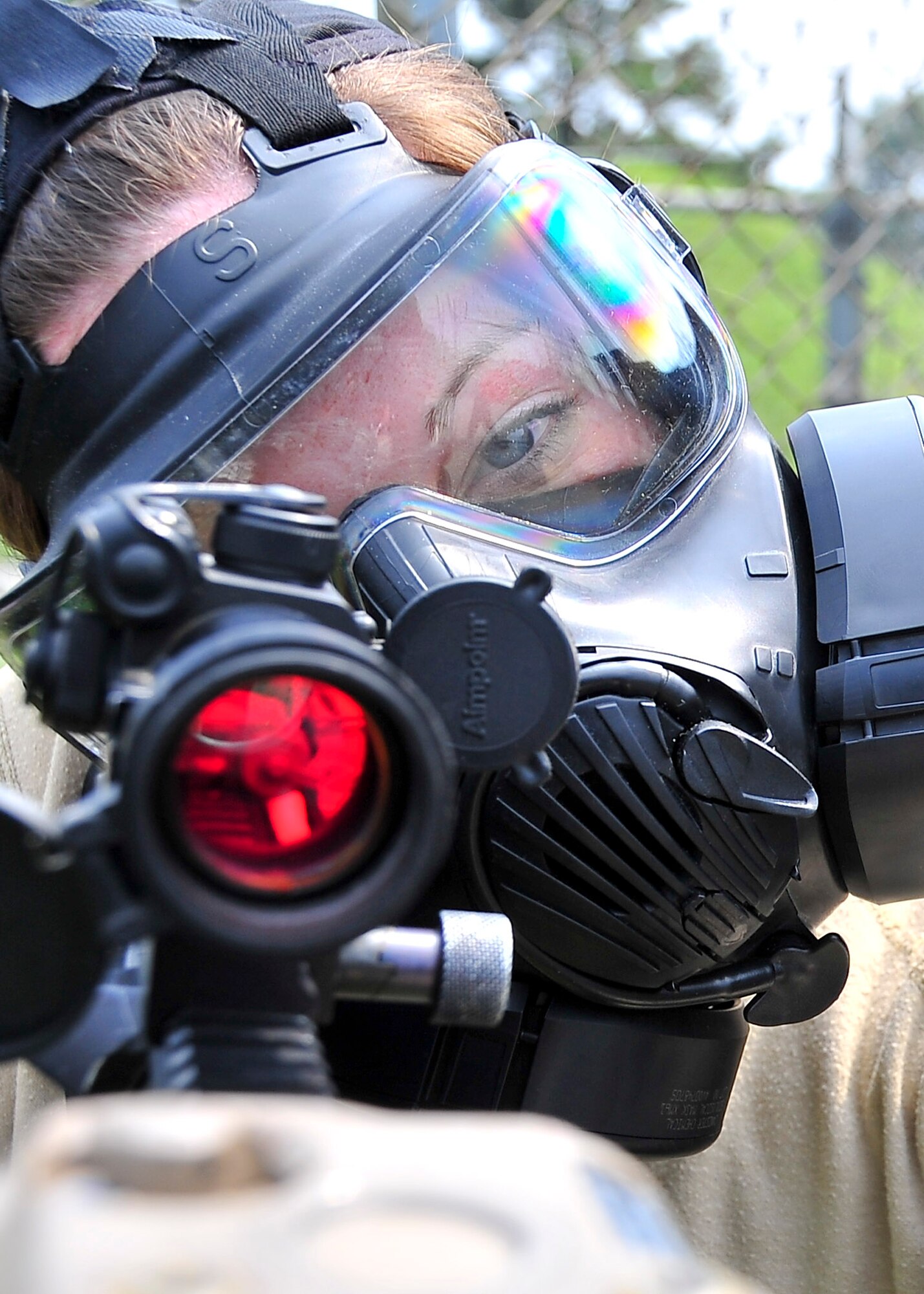 Senior Airman Courtney McClellan, 51st Security Forces Squadron base pass technician, engages members of the 51st Fighter Wing during an  attack hill 180 Sep. 01, 2011 during exercise Beverly-Midnight 11-04. Exercises such as this test Osan's ability to survive and operate during a war-time constraint. (U.S. Air Force photo/Senior Airman Adam Grant)  