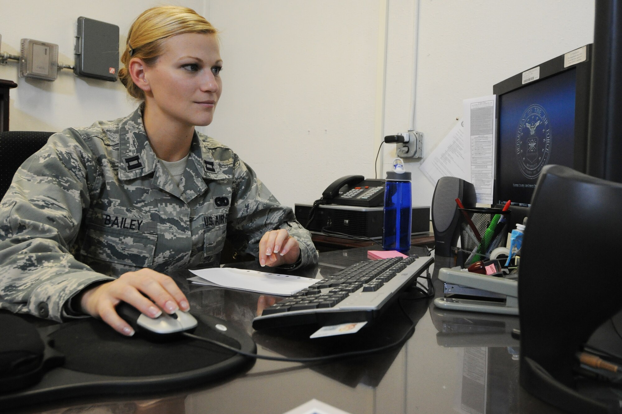 KUNSAN AIR BASE, Republic of Korea -- Capt. Aileen Bailey, 8th Logistics Readiness Squadron materiel management flight commander, looks at information regarding the expeditionary combat support system here Sept. 1. Bailey is one of this week’s pride of the pack recipients. (U.S. Air Force photo/Senior Airman Brittany Y. Bateman)