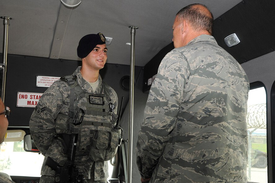 KUNSAN AIR BASE, Republic of Korea -- Gen. Gary L. North, Pacific Air Forces commander, talks with Airman 1st Class Joshua Vigder, 8th Security Forces Squadron, during a visit here Aug. 22.  The general toured facilities and spoke to Wolf Pack members to reiterate their importance and their roles during his visit to Kunsan.  (U.S. Air Force photo/Staff Sgt. Rasheen Douglas)