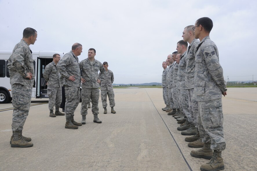 KUNSAN AIR BASE, Republic of Korea -- Gen. Gary L. North, Pacific Air Forces commander, talks with Wolf Pack Airmen on the flight line here Aug. 22.  The general toured facilities and spoke to Wolf Pack members to reiterate their importance and their roles during his visit to Kunsan.  (U.S. Air Force photo/Staff Sgt. Rasheen Douglas)